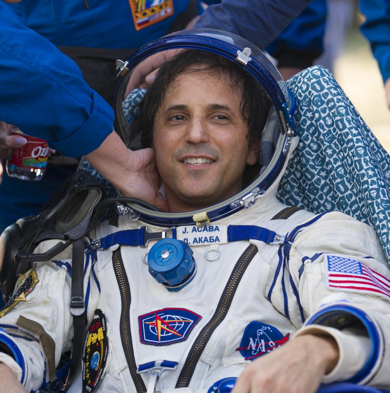 Expedition 32 NASA Flight Engineer Joe Acaba is seen as he rests outside the Soyuz TMA-04M capsule just minutes after he and Expedition 32 Soyuz Commander Gennady Padalka and Russian Flight Engineer Sergei Revin landed in a remote area outside of the town of Arkalyk, Kazakhstan, on Monday, Sept. 17, 2012. NASA Astronaut Acaba, Russian Cosmonauts Padalka and Revin are returning from five months onboard the International Space Station where they served as members of the Expedition 31 and 32 crews. Photo Credit: (NASA/Carla Cioffi)
