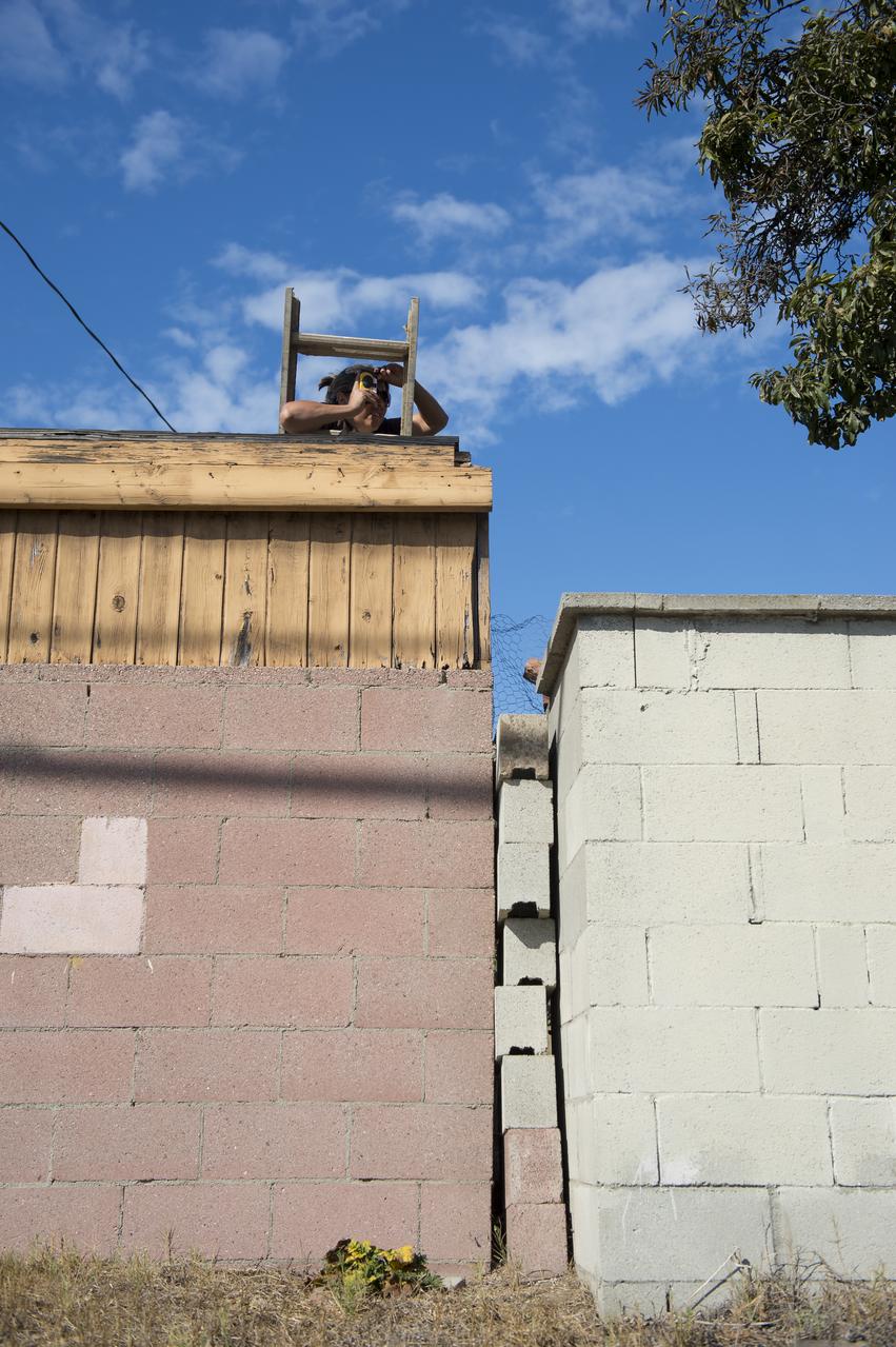 A spectator photographs the space shuttle Endeavour as it passes by on its way to its new home at the California Science Center in Los Angeles, Friday, Oct. 12, 2012.  Endeavour, built as a replacement for space shuttle Challenger, completed 25 missions, spent 299 days in orbit, and orbited Earth 4,671 times while traveling 122,883,151 miles.  Beginning Oct. 30, the shuttle will be on display in the CSC's Samuel Oschin Space Shuttle Endeavour Display Pavilion, embarking on its new mission to commemorate past achievements in space and educate and inspire future generations of explorers.  Photo Credit: (NASA/Carla Cioffi)