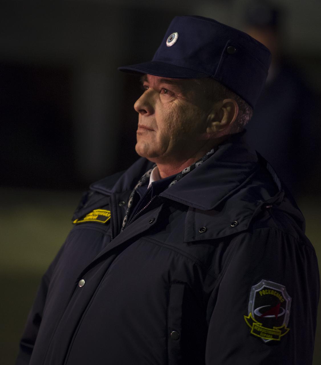 A ROSCOSMOS space agency worker watches as the door of the Soyuz rocket assembly building is opened so that the Soyuz rocket may be rolled out to the launch pad by train, on Sunday, October 21, 2012, at the Baikonur Cosmodrome in Kazakhstan. Launch of the Soyuz rocket is scheduled for October 23 and will send Expedition 33/34 Flight Engineer Kevin Ford of NASA, Soyuz Commander Oleg Novitskiy and Flight Engineer Evgeny Tarelkin of ROSCOSMOS on a five-month mission aboard the International Space Station. Photo Credit: (NASA/Bill Ingalls)