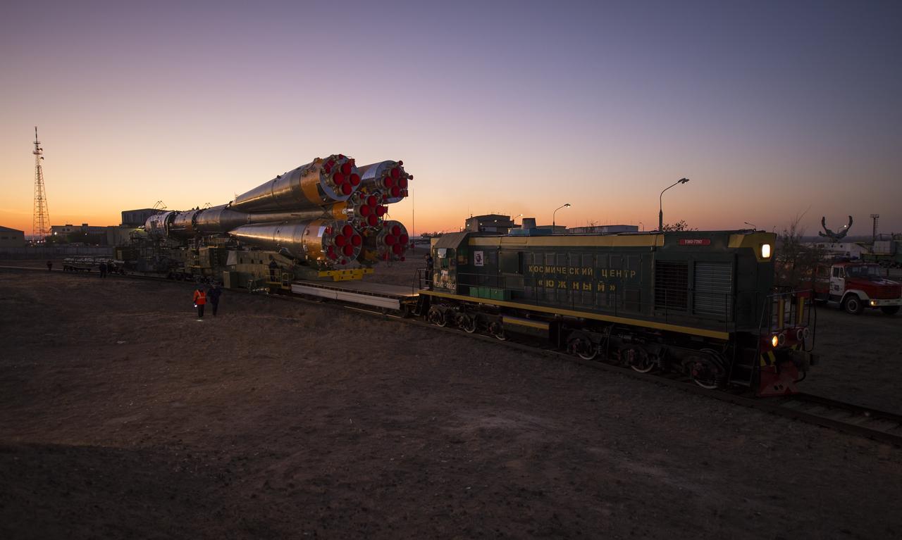 The Soyuz rocket is rolled out to the launch pad by train, on Sunday, October 21, 2012, at the Baikonur Cosmodrome in Kazakhstan. Launch of the Soyuz rocket is scheduled for October 23 and will send Expedition 33/34 Flight Engineer Kevin Ford of NASA, Soyuz Commander Oleg Novitskiy and Flight Engineer Engineer Evgeny Tarelkin of ROSCOSMOS on a five-month mission aboard the International Space Station. Photo Credit: (NASA/Bill Ingalls)