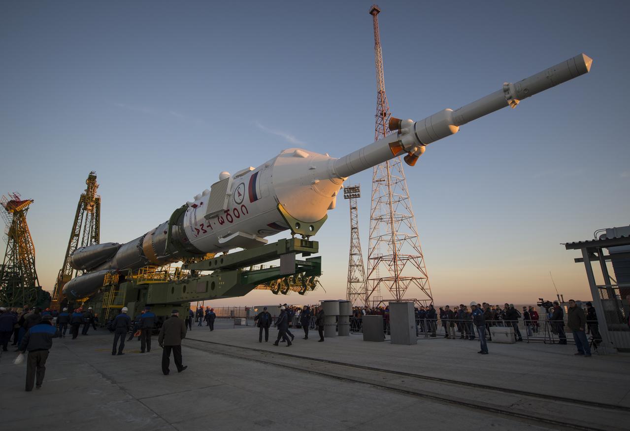 The Soyuz rocket is ready to be erected into position after being rolled out to the launch pad by train, on Sunday, October 21, 2012, at the Baikonur Cosmodrome in Kazakhstan.  Launch of the Soyuz rocket is scheduled for October 23 and will send Expedition 33/34 Flight Engineer Kevin Ford of NASA, Soyuz Commander Oleg Novitskiy and Flight Engineer Evgeny Tarelkin of ROSCOSMOS on a five-month mission aboard the International Space Station.  Photo Credit: (NASA/Bill Ingalls)