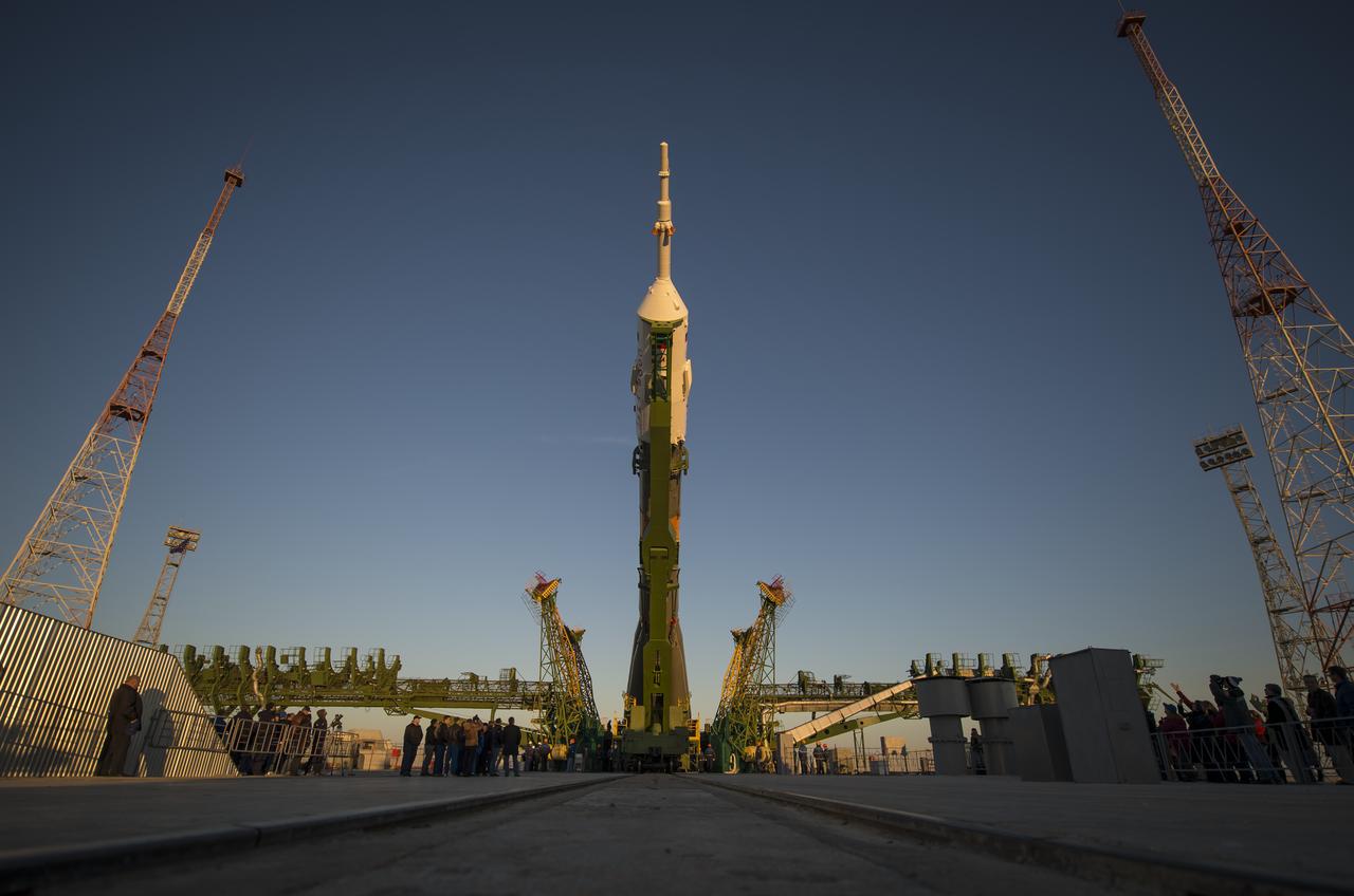 The Soyuz rocket is erected into position after being rolled out to the launch pad by train, on Sunday, October 21, 2012, at the Baikonur Cosmodrome in Kazakhstan. Launch of the Soyuz rocket is scheduled for October 23 and will send Expedition 33/34 Flight Engineer Kevin Ford of NASA, Soyuz Commander Oleg Novitskiy and Flight Engineer Evgeny Tarelkin of ROSCOSMOS on a five-month mission aboard the International Space Station. Photo Credit: (NASA/Bill Ingalls)