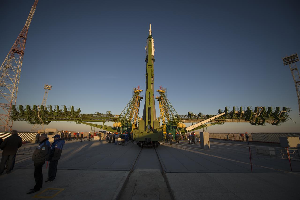 The Soyuz rocket is erected into position after being rolled out to the launch pad by train, on Sunday, October 21, 2012, at the Baikonur Cosmodrome in Kazakhstan.  Launch of the Soyuz rocket is scheduled for October 23 and will send Expedition 33/34 Flight Engineer Kevin Ford of NASA, Soyuz Commander Oleg Novitskiy and Flight Engineer Evgeny Tarelkin of ROSCOSMOS on a five-month mission aboard the International Space Station.  Photo Credit: (NASA/Bill Ingalls)