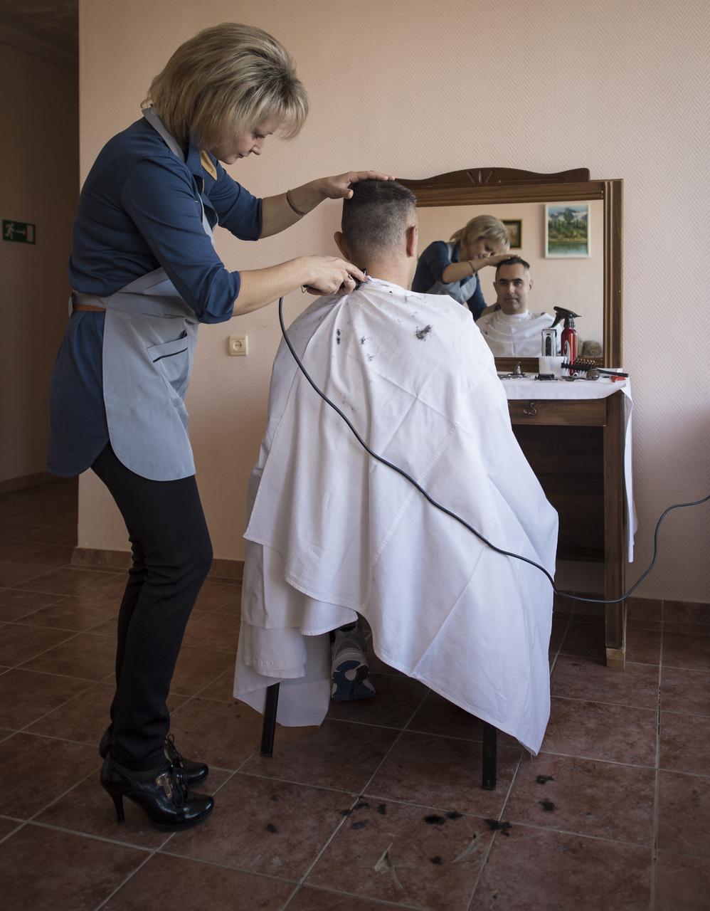 Expedition 33 Flight Engineer Evgeny Tarelkin gets his hair cut at the Cosmonaut Hotel, on Sunday, October 21, 2012, at the Baikonur Cosmodrome in Kazakhstan. Launch of the Soyuz rocket is scheduled for October 23 and will send Expedition 33/34 Flight Engineer Kevin Ford of NASA, Soyuz Commander Oleg Novitskiy and Flight Engineer Engineer Evgeny Tarelkin of ROSCOSMOS on a five-month mission aboard the International Space Station. Photo Credit: (NASA/Bill Ingalls)