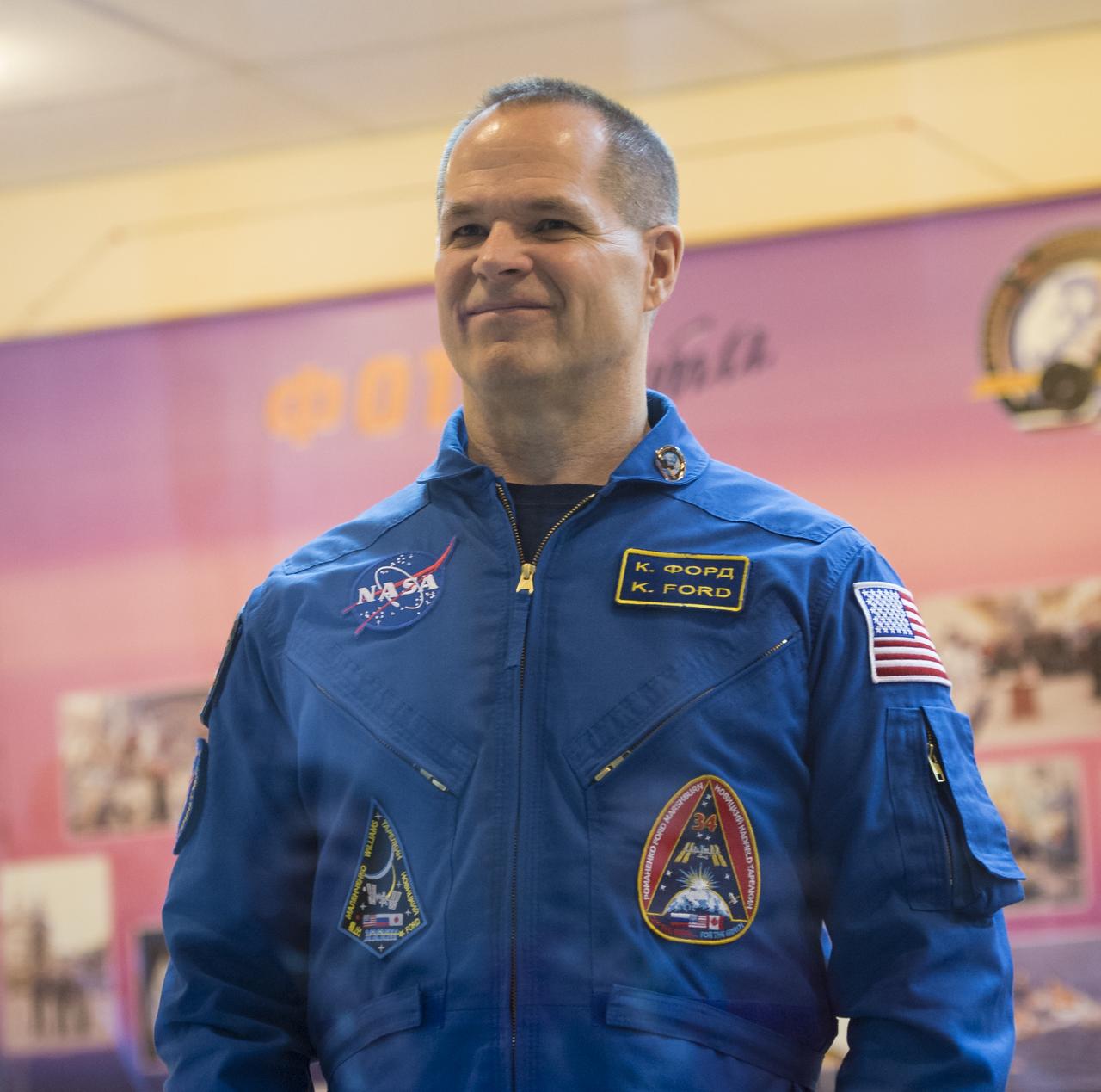 Expedition 33 Flight Engineer Kevin Ford stands as he is introduced at the start of a press conference held at the Cosmonaut Hotel, on Monday, October 22, 2012, in Baikonur, Kazakhstan. Launch of the Soyuz rocket is scheduled for October 23 and will send Expedition 33/34 Flight Engineer Kevin Ford of NASA, Soyuz Commander Oleg Novitskiy and Flight Engineer Evgeny Tarelkin of ROSCOSMOS on a five-month mission aboard the International Space Station. Photo Credit: (NASA/Bill Ingalls)
