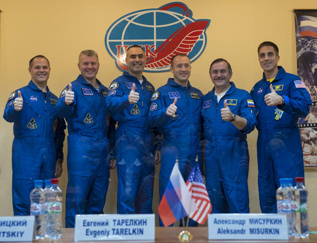 Expedition 33/34 prime crew members from left; Flight Engineer Kevin Ford of NASA, Soyuz Commander Oleg Novitskiy, Flight Engineer Evgeny Tarelkin of ROSCOSMOS, and backup crew members; Russian cosmonaut Alexander Misurkin, Russian cosmonaut Pavel Vinogradov, and NASA astronaut Chris Cassidy pose for a group photograph after the end of a press conference held at the Cosmonaut Hotel, on Monday, October 22, 2012, in Baikonur, Kazakhstan. Launch of the Soyuz rocket is scheduled for October 23 and will send Ford, Novitskiy and Tarelkin on a five-month mission aboard the International Space Station. Photo Credit: (NASA/Bill Ingalls)