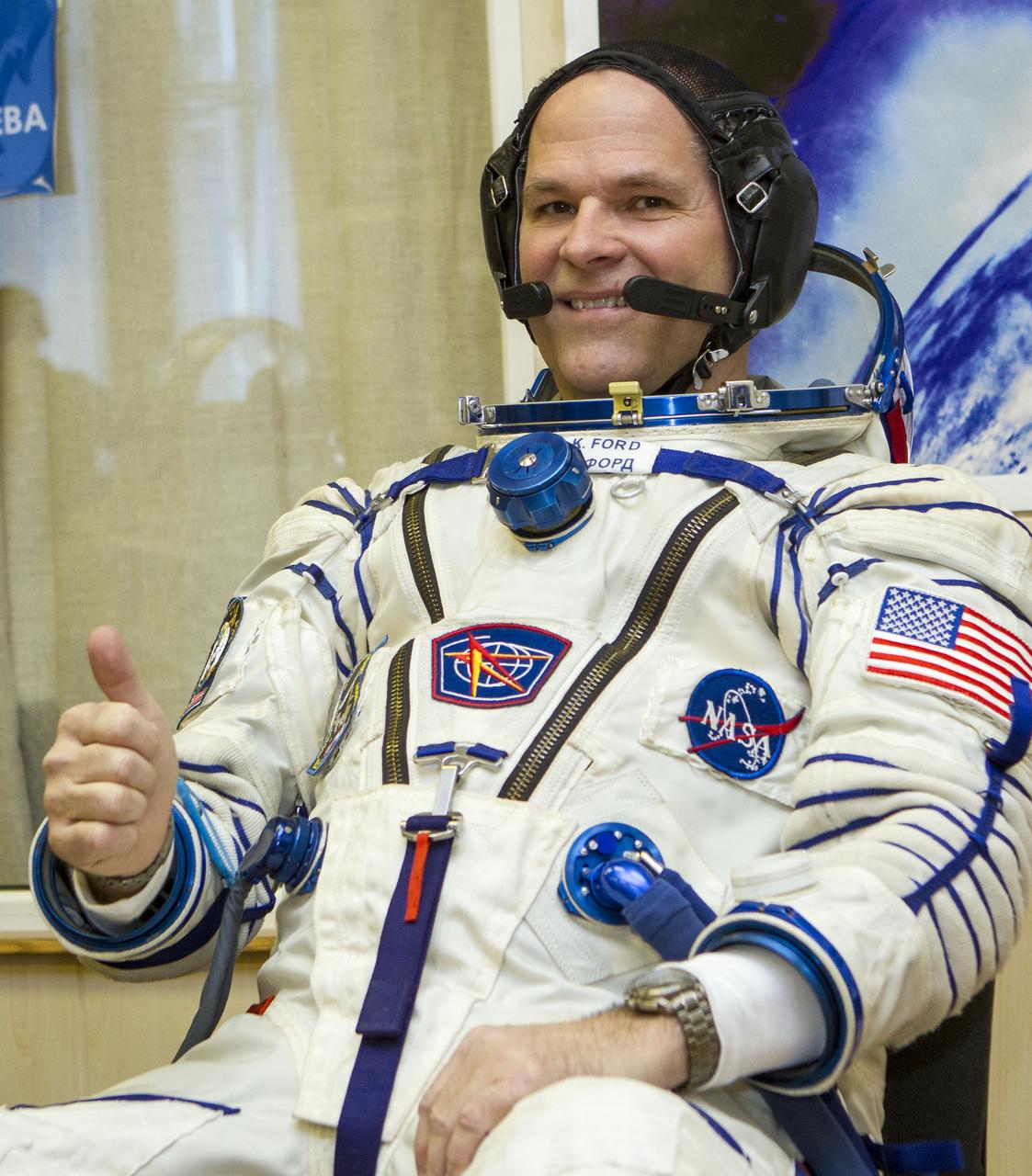 Expedition 33/34 Flight Engineer Kevin Ford gives a thumbs up as he waits to have his Russian Sokol suit pressure checked ahead of his launch to the International Space Station with fellow cremates, Soyuz Commander Oleg Novitskiy, and Flight Engineer Evgeny Tarelkin , on Tuesday, October 23, 2012, in Baikonur, Kazakhstan. Launch of the Soyuz rocket will send Ford, Novitskiy and Tarelkin on a five-month mission aboard the International Space Station. Photo Credit: (NASA/GCTC/Andrey Shelepin)