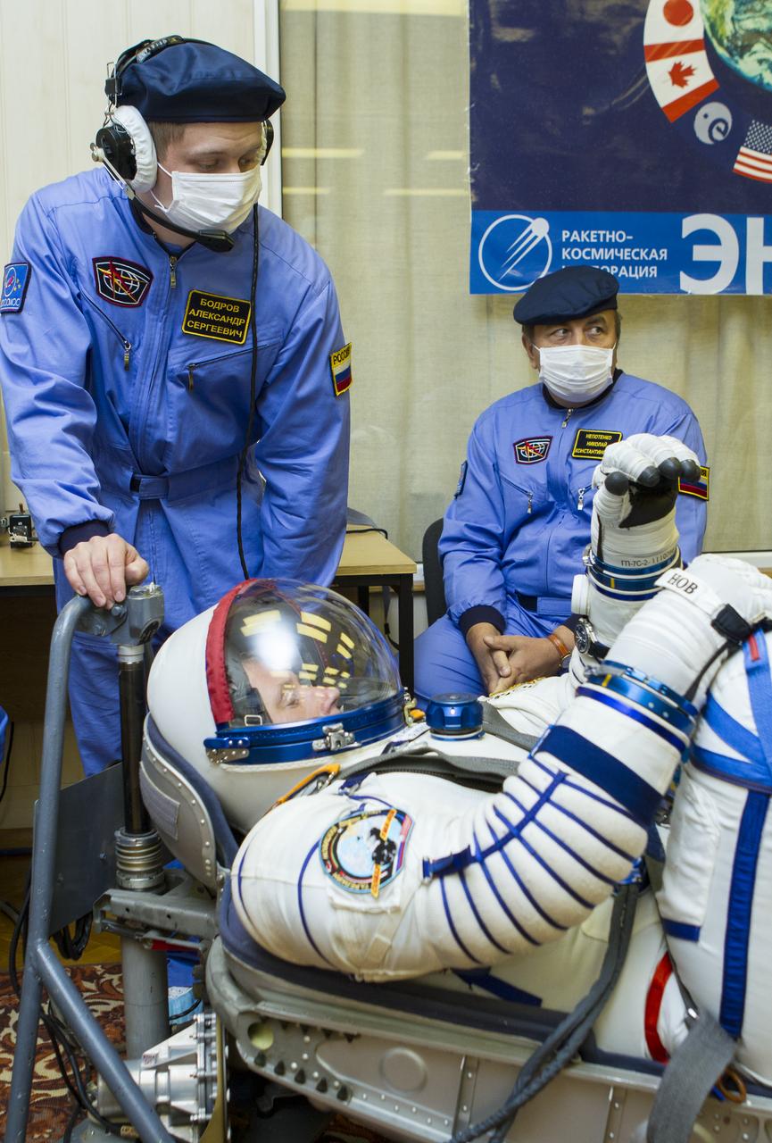 Expedition 33/34 Soyuz Commander Oleg Novitskiy has his Russian Sokol suit pressure checked ahead of his launch onboard a Soyuz TMA-06M spacecraft to the International Space Station with fellow cremates, Flight Engineer Kevin Ford, and Flight Engineer Evgeny Tarelkin, on Tuesday, October 23, 2012, in Baikonur, Kazakhstan. Launch of the Soyuz rocket will send Ford, Novitskiy and Tarelkin on a five-month mission aboard the International Space Station. Photo Credit: (NASA/GCTC/Andrey Shelepin)