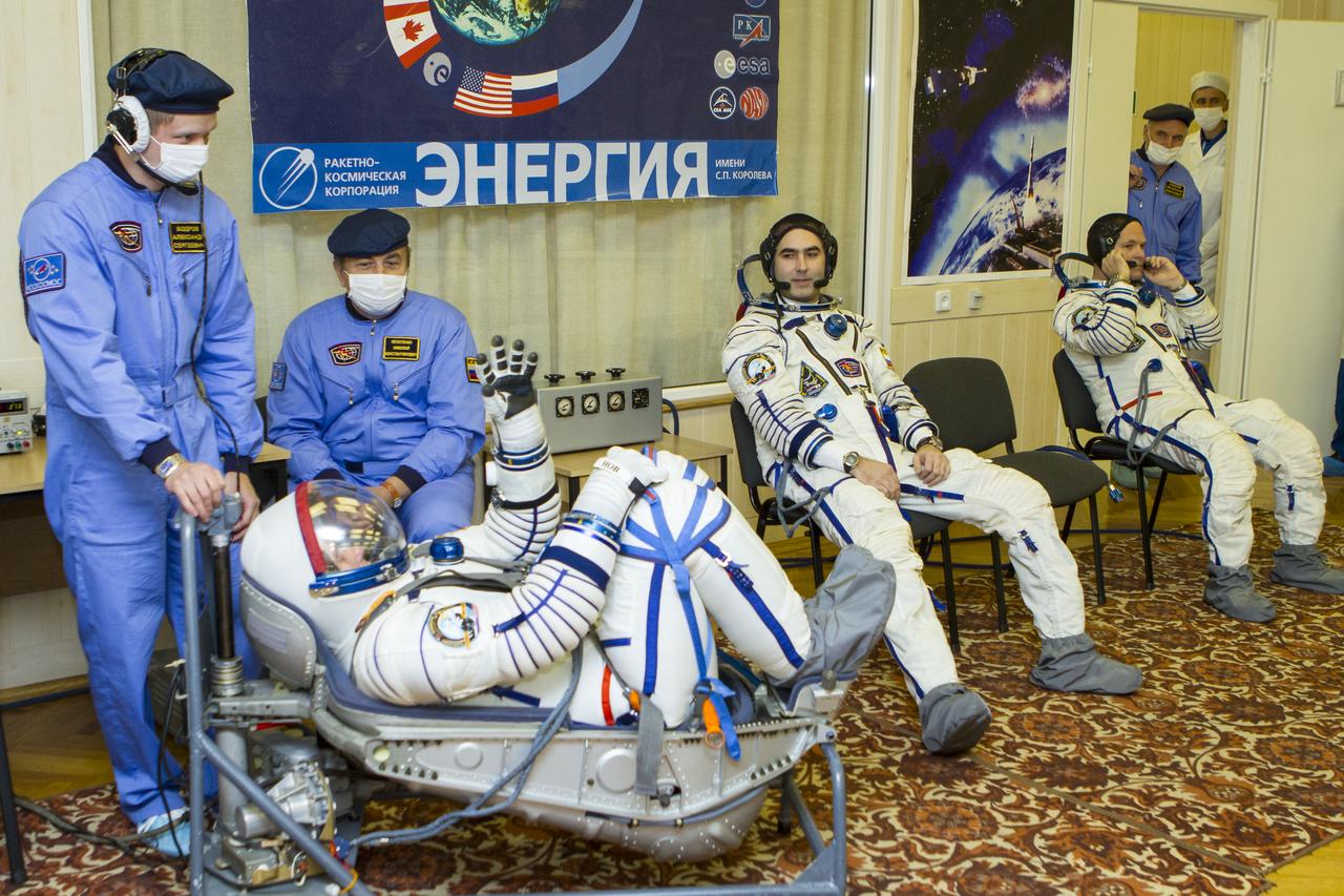 Expedition 33/34 Soyuz Commander Oleg Novitskiy has his Russian Sokol suit pressure checked ahead of his launch onboard a Soyuz TMA-06M spacecraft to the International Space Station with fellow cremates, Flight Engineer Kevin Ford, and Flight Engineer Evgeny Tarelkin, on Tuesday, October 23, 2012, in Baikonur, Kazakhstan. Launch of the Soyuz rocket will send Ford, Novitskiy and Tarelkin on a five-month mission aboard the International Space Station. Photo Credit: (NASA/GCTC/Andrey Shelepin)
