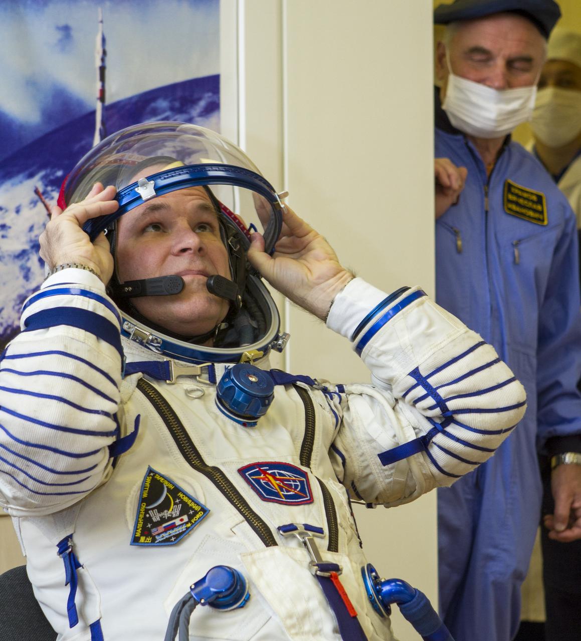 Expedition 33/34 Flight Engineer Kevin Ford waits to have his Russian Sokol suit pressure checked ahead of his launch to the International Space Station with fellow cremates, Soyuz Commander Oleg Novitskiy, and Flight Engineer Evgeny Tarelkin , on Tuesday, October 23, 2012, in Baikonur, Kazakhstan. Launch of the Soyuz rocket will send Ford, Novitskiy and Tarelkin on a five-month mission aboard the International Space Station. Photo Credit: (NASA/GCTC/Andrey Shelepin)