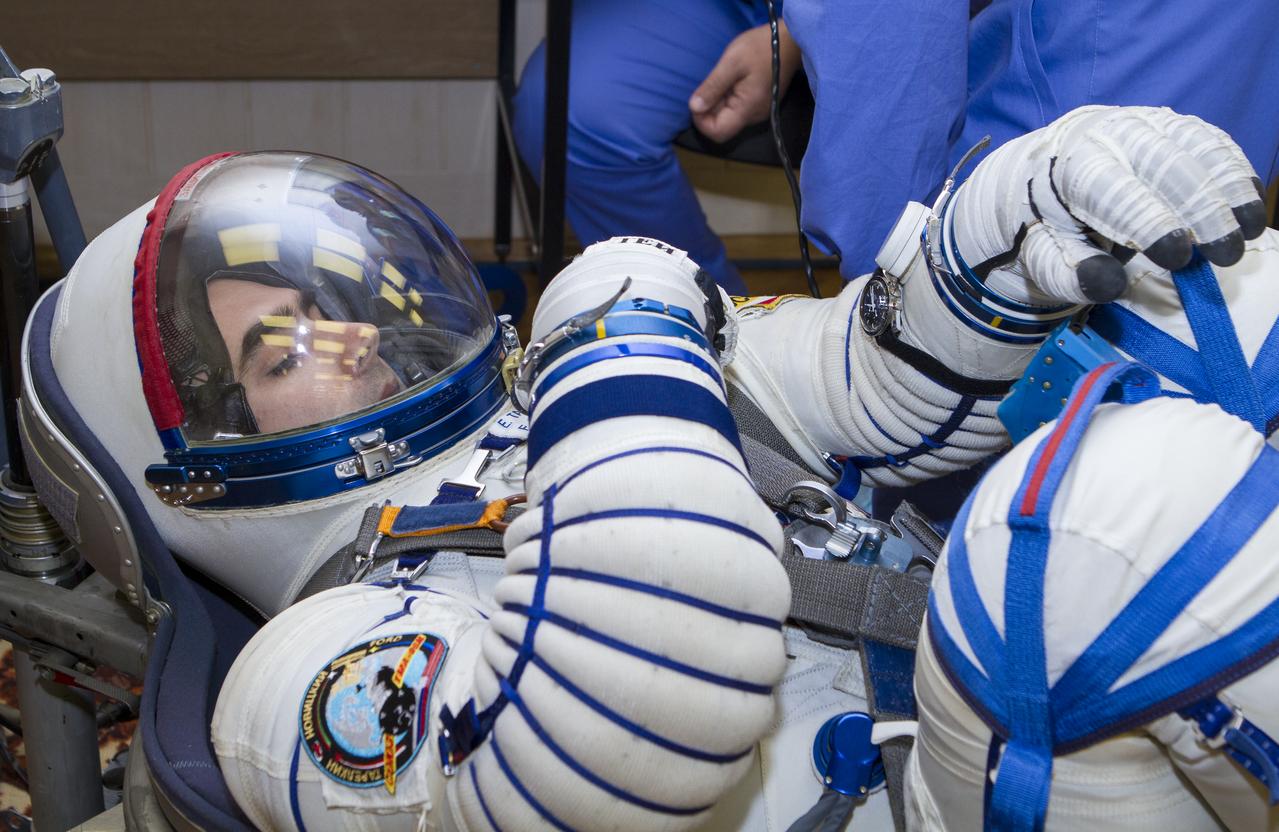Expedition 33/34 Flight Engineer Evgeny Tarelkin has his Russian Sokol suit pressure checked ahead of his launch onboard a Soyuz TMA-06M spacecraft to the International Space Station with fellow cremates, Flight Engineer Kevin Ford, and Soyuz Commander Oleg Novitskiy, on Tuesday, October 23, 2012, in Baikonur, Kazakhstan. Launch of the Soyuz rocket will send Ford, Novitskiy and Tarelkin on a five-month mission aboard the International Space Station.  Photo Credit: (NASA/GCTC/Andrey Shelepin)