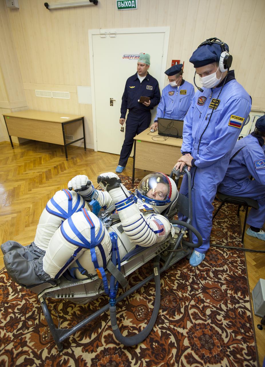 Expedition 33/34 Flight Engineer Kevin Ford has his Russian Sokol suit pressure checked ahead of his launch onboard a Soyuz TMA-06M spacecraft to the International Space Station with fellow cremates, Flight Engineer Evgeny Tarelkin, and Soyuz Commander Oleg Novitskiy, on Tuesday, October 23, 2012, in Baikonur, Kazakhstan. Launch of the Soyuz rocket will send Ford, Novitskiy and Tarelkin on a five-month mission aboard the International Space Station. Photo Credit: (NASA/GCTC/Andrey Shelepin)