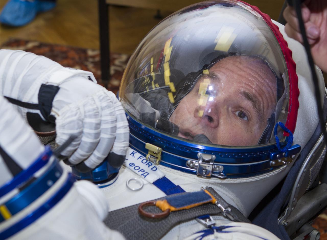 Expedition 33/34 Flight Engineer Kevin Ford has his Russian Sokol suit pressure checked ahead of his launch onboard a Soyuz TMA-06M spacecraft to the International Space Station with fellow cremates, Flight Engineer Evgeny Tarelkin, and Soyuz Commander Oleg Novitskiy, on Tuesday, October 23, 2012, in Baikonur, Kazakhstan. Launch of the Soyuz rocket will send Ford, Novitskiy and Tarelkin on a five-month mission aboard the International Space Station. Photo Credit: (NASA/GCTC/Andrey Shelepin)