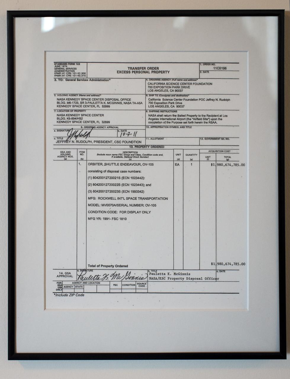 A government Transfer Order for Excess Personal Property is seen framed outside the office of President and CEO, California Science Center, Jeffrey N. Rudolph, on Tuesday, Oct. 30, 2012, in Los Angeles. The grand opening ceremony for the California Science center's Samuel Oschin Space Shuttle Endeavour Display Pavilion took place on Tuesday, Oct. 30, 2012. Endeavour, built as a replacement for space shuttle Challenger, completed 25 missions, spent 299 days in orbit, and orbited Earth 4,671 times while traveling 122,883,151 miles. Photo Credit: (NASA/Bill Ingalls)