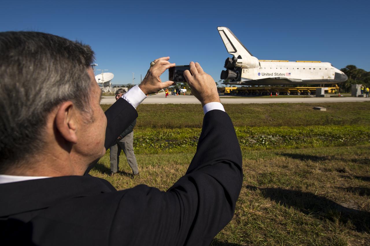 Kennedy Space Center Director Robert Cabana takes a picture of space shuttle Atlantis, Friday, Nov. 2, 2012, in Cape Canaveral, Fla. The spacecraft traveled 125,935,769 miles during 33 spaceflights, including 12 missions to the International Space Station. Its final flight, STS-135, closed out the Space Shuttle Program era with a landing on July 21, 2011. Photo Credit: (NASA/Bill Ingalls)
