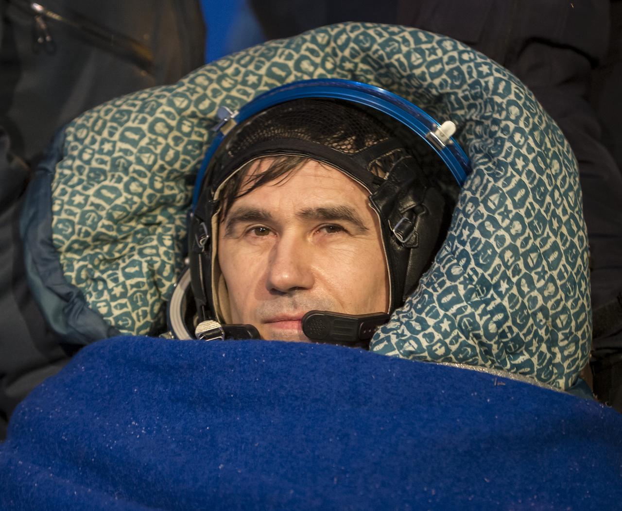 Expedition 33 Flight Engineer Yuri Malenchenko of ROSCOSMOS (Russian Federal Space Agency) rest in a chair outside the Soyuz Capsule after he and Commander Sunita Williams of NASA, and Flight Engineer Akihiko Hoshide of JAXA (Japan Aerospace Exploration Agency), landed their Soyuz spacecraft in a remote area outside the town of Arkalyk, Kazakhstan, on Monday, Nov. 19, 2012. Williams, Hoshide and Malenchenko returned from four months onboard the International Space Station. Photo Credit: (NASA/Bill Ingalls)