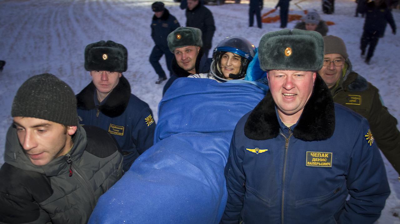 Expedition 33 Commander Sunita Williams of NASA is carried to a medical tent shortly after she and Flight Engineers Yuri Malenchenko of ROSCOSMOS (Russian Federal Space Agency), and Akihiko Hoshide of JAXA (Japan Aerospace Exploration Agency), landed their Soyuz spacecraft in a remote area outside the town of Arkalyk, Kazakhstan, on Monday, Nov. 19, 2012. Williams, Hoshide and Malenchenko returned from four months onboard the International Space Station. Photo Credit: (NASA/Bill Ingalls)