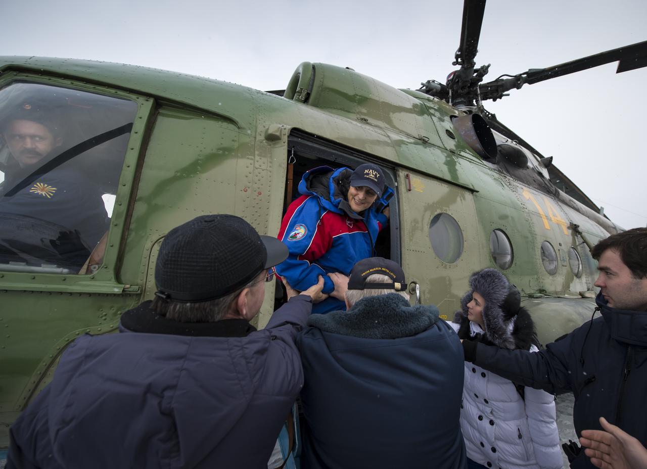 Expedition 33 Commander Sunita Williams of NASA is helped out of a Russian Search and Rescue helicopter after her flight back to Kustanany, Kazakhstan just a few hours after Williams and Flight Engineers Yuri Malenchenko of ROSCOSMOS (Russian Federal Space Agency), and Akihiko Hoshide of JAXA (Japan Aerospace Exploration Agency), landed their Soyuz spacecraft in a remote area outside the town of Arkalyk, Kazakhstan, on Monday, Nov. 19, 2012. Williams, Hoshide and Malenchenko returned from four months onboard the International Space Station. Photo Credit: (NASA/Bill Ingalls)