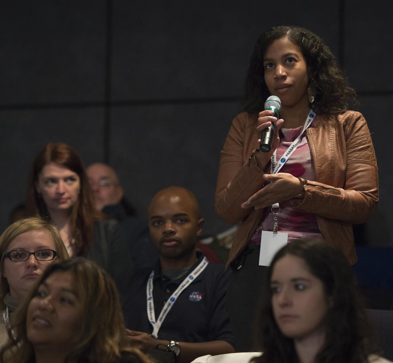 A participant at a NASA Social in Washington asks astronaut Joe Acaba a question, Tuesday, Dec. 4, 2012, at NASA Headquarters. Acaba launched to the International Space Station on a Russian Soyuz spacecraft May 15, 2012, spending 123 days aboard as a flight engineer of the Expedition 31 and 32 crews. He recently returned to Earth on Sept. 17 after four months in low earth orbit. Photo Credit: (NASA/Carla Cioffi)