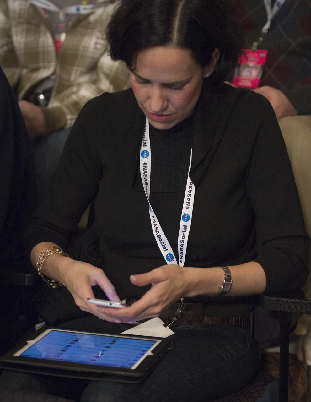 A NASA Social participant tweets during as astronaut Joe Acaba answers questions from the audience at NASA Headquaters, Tuesday, Dec. 4, 2012 in Washington. NASA astronaut Acaba launched to the ISS on a Russian Soyuz spacecraft May 15, 2012, spending 123 days aboard as a flight engineer of the Expedition 31 and 32 crews. He recently returned to Earth on Sept. 17 after four months in low earth orbit. Photo Credit: (NASA/Carla Cioffi)