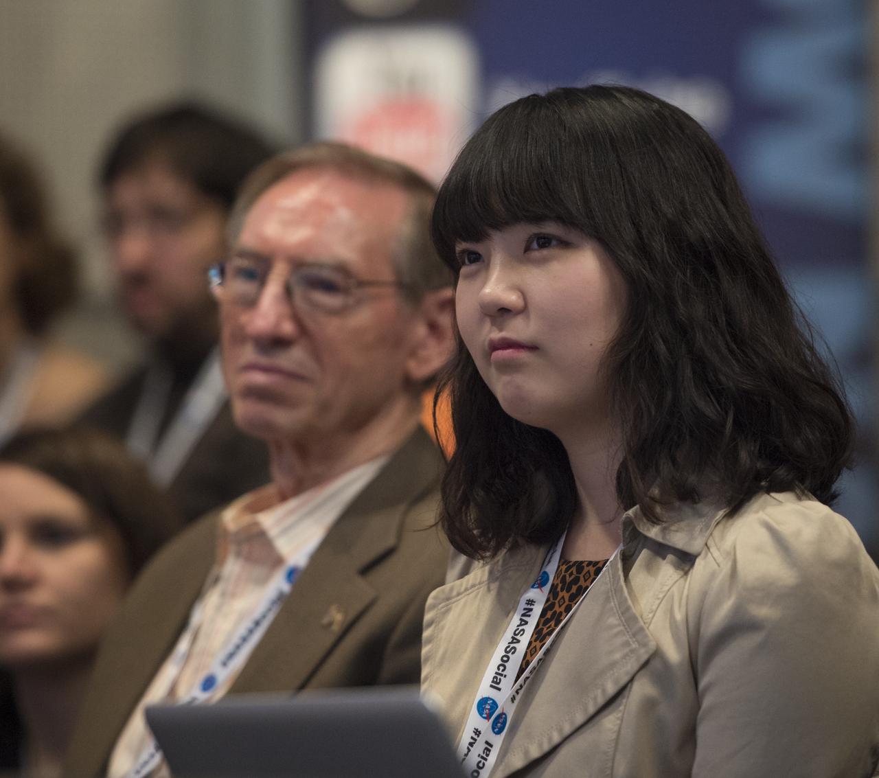 A participant at a NASA Social in Washington listens to astronaut Joe Acaba answer questions about his time living aboard the International Space Station, Tuesday, Dec. 4, 2012 at NASA Headquarters.  NASA astronaut Acaba launched to the ISS on a Russian Soyuz spacecraft May 15, 2012, spending 123 days aboard as a flight engineer of the Expedition 31 and 32 crews. He recently returned to Earth on Sept. 17 after four months in low earth orbit.  Photo Credit:  (NASA/Carla Cioffi)