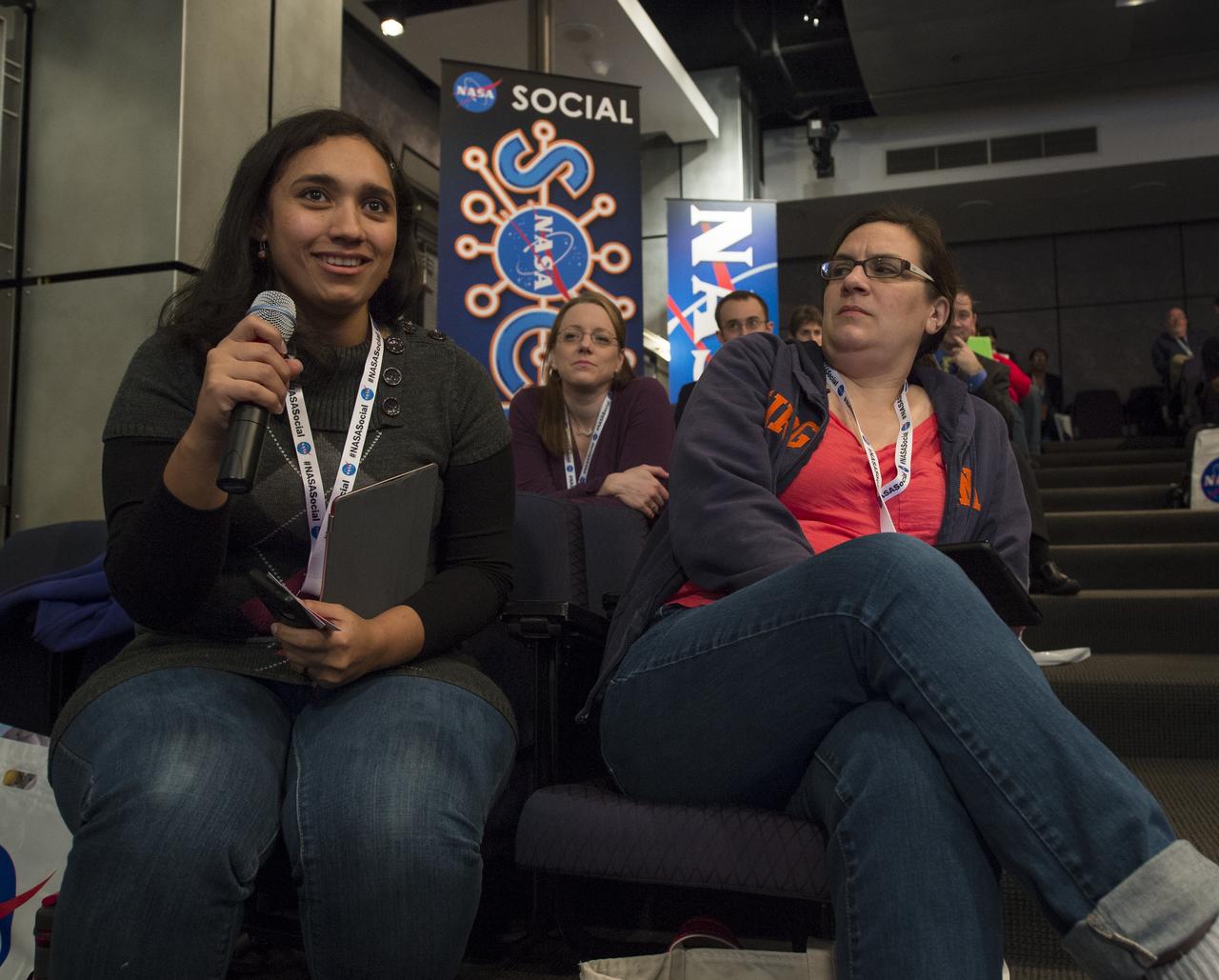 A participant at a NASA Social in Washington asks astronaut Joe Acaba a question, Tuesday, Dec. 4, 2012, at NASA Headquarters. Acaba launched to the International Space Station on a Russian Soyuz spacecraft May 15, 2012, spending 123 days aboard as a flight engineer of the Expedition 31 and 32 crews. He recently returned to Earth on Sept. 17 after four months in low earth orbit. Photo Credit: (NASA/Carla Cioffi)