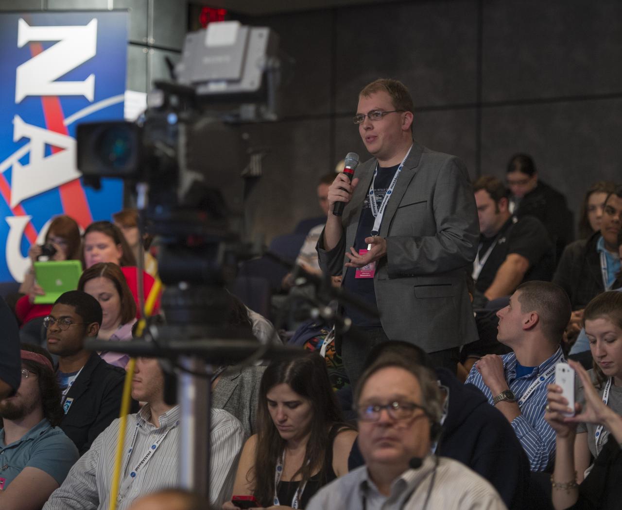 A participant at a NASA Social in Washington asks astronaut Joe Acaba a question, Tuesday, Dec. 4, 2012, at NASA Headquarters. Acaba launched to the International Space Station on a Russian Soyuz spacecraft May 15, 2012, spending 123 days aboard as a flight engineer of the Expedition 31 and 32 crews. He recently returned to Earth on Sept. 17 after four months in low earth orbit. Photo Credit: (NASA/Carla Cioffi)