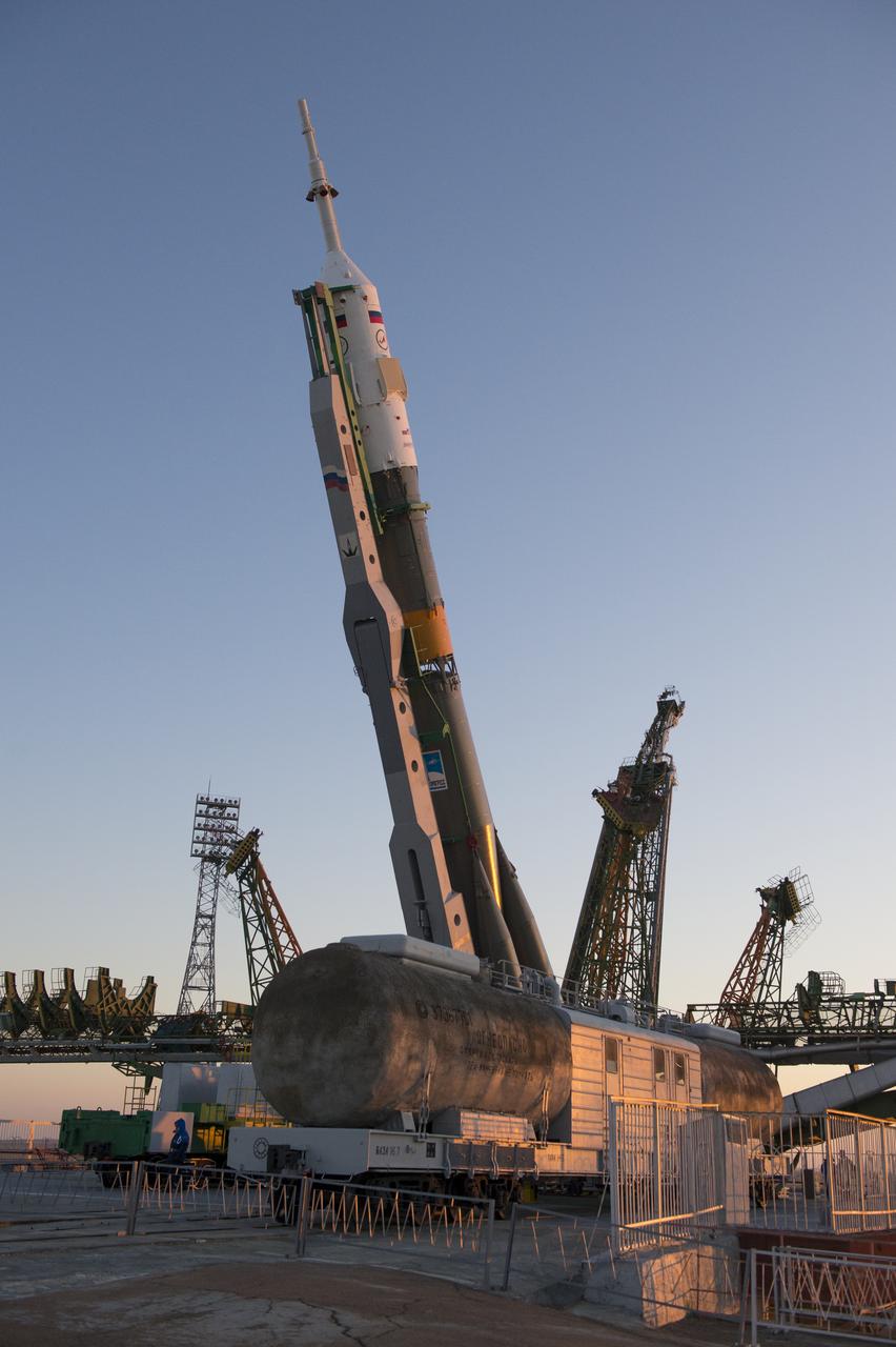 The Soyuz rocket is erected into position after being rolled out to the launch pad by train on Monday, December 17, 2012, at the Baikonur Cosmodrome in Kazakhstan.  Launch of the Soyuz rocket is scheduled for December 19 and will send Expedition 34/35 Flight Engineer Tom Marshburn of NASA, Soyuz Commander Roman Romanenko and Expedition 35 Commander Chris Hadfield of the Canadian Space Agency (CSA) on a five-month mission aboard the International Space Station.  Photo Credit: (NASA/Carla Cioffi).  Photo Credit: (NASA/Carla Cioffi)