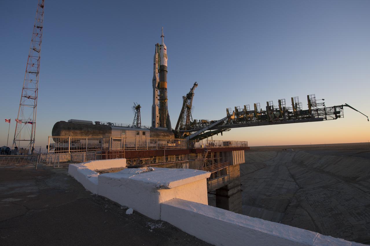 The Soyuz rocket is erected into position after being rolled out to the launch pad by train on Monday, December 17, 2012, at the Baikonur Cosmodrome in Kazakhstan.  Launch of the Soyuz rocket is scheduled for December 19 and will send Expedition 34/35 Flight Engineer Tom Marshburn of NASA, Soyuz Commander Roman Romanenko and Expedition 35 Commander Chris Hadfield of the Canadian Space Agency (CSA) on a five-month mission aboard the International Space Station.  Photo Credit: (NASA/Carla Cioffi).  Photo Credit: (NASA/Carla Cioffi)
