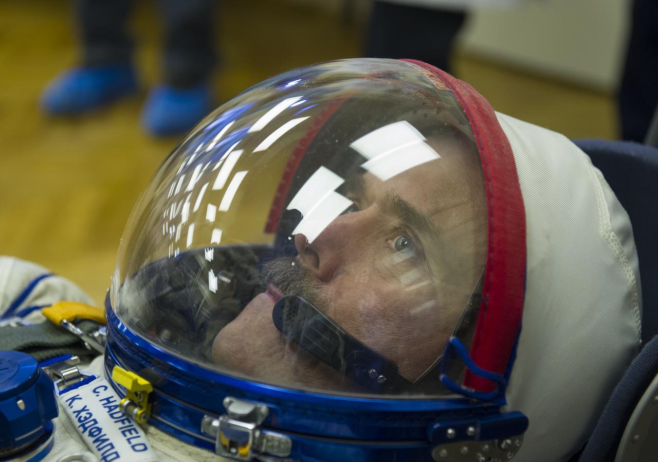 Expedition 34/35 Flight Engineer Chris Hadfield has his Russian Sokol suit pressure checked ahead of his launch onboard a Soyuz TMA-07M spacecraft to the International Space Station with fellow cremates, Flight Engineer Tom Marshburn and Soyuz Commander Roman Romanenko, on Wednesday, Dec. 19, 2012, in Baikonur, Kazakhstan. Launch of the Soyuz rocket will send Hadfield, Romanenko and Marshburn on a five-month mission aboard the International Space Station.  Photo Credit: (NASA/GCTC/Andrey Shelepin)