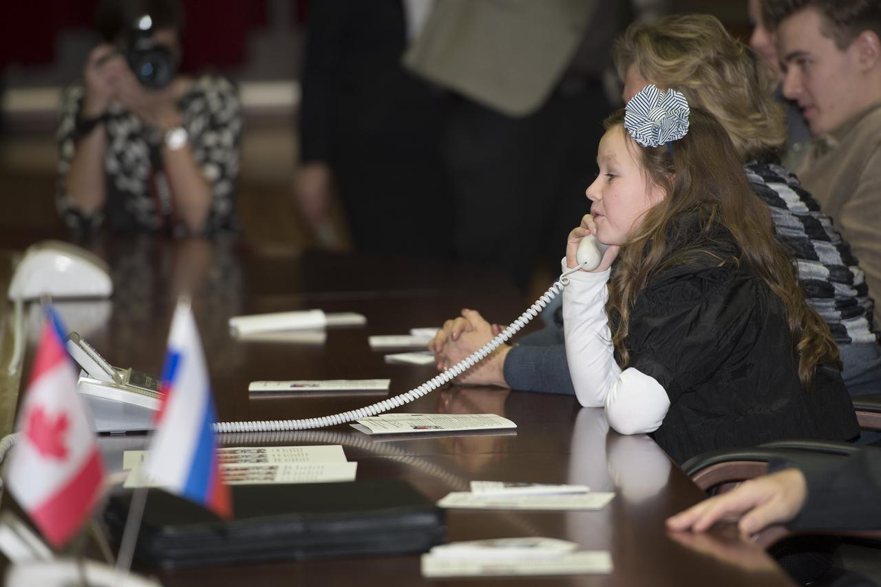 The daughter of Russian cosmonaut Roman Romanenko, Anastasia Romanenko, speaks to her father shortly after his arrival aboard the International Space Station, on Friday, Dec. 21, 2012 in Korolev, Russia.  Onboard the Soyuz spacecraft are Expedition 34 Soyuz Commander Roman Romanenko, Flight Engineer Chris Hadfield, and NASA Flight Engineer Tom Marshburn.  The crew of three launched at 6:12 p.m. Kazakhstan time on Wednesday, Dec. 19 from the Baikonur Cosmodrome in Kazakhstan.  Photo Credit (NASA/Carla Cioffi)