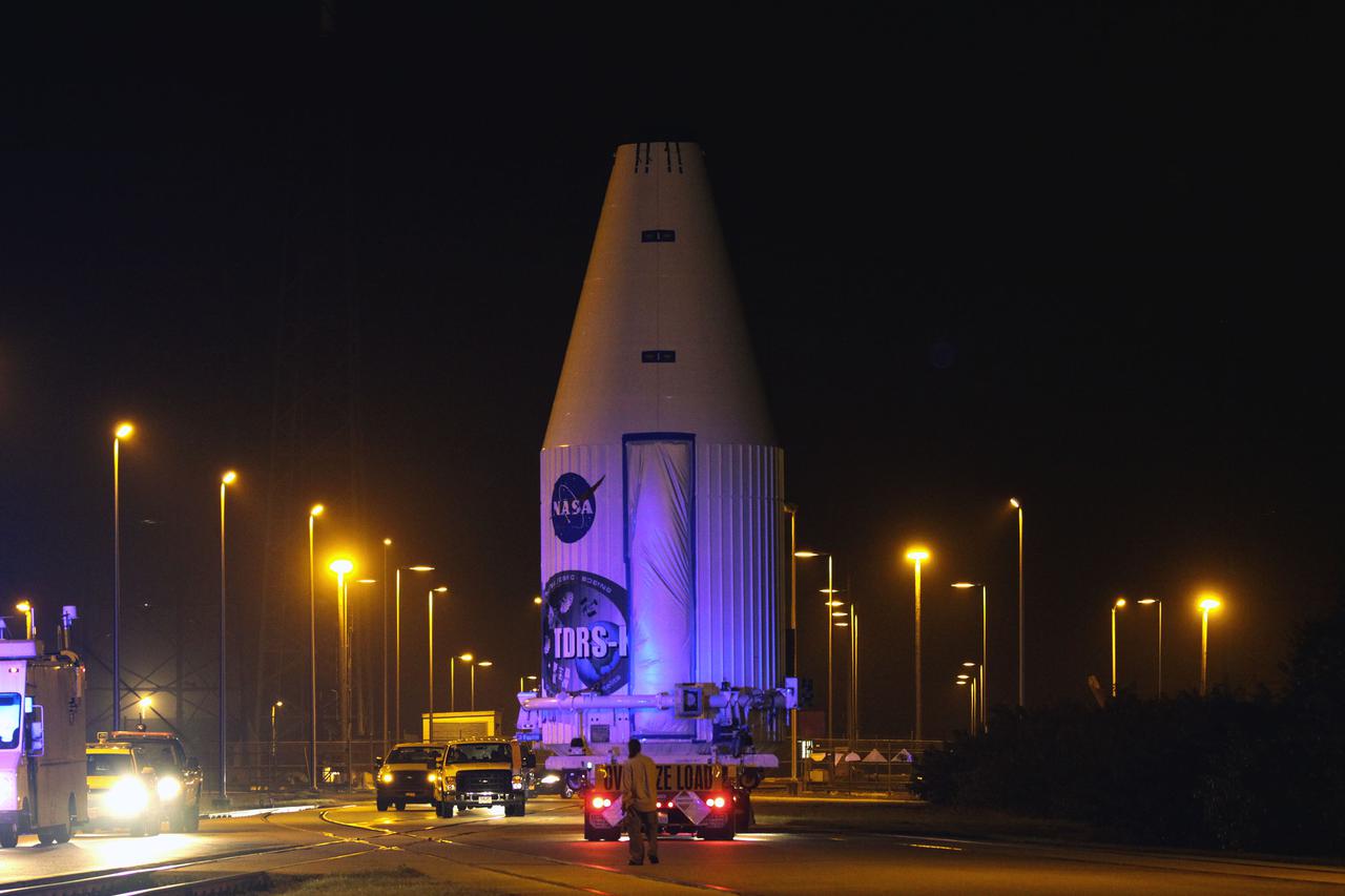 CAPE CANAVERAL, Fla. –NASA's Tracking and Data Relay Satellite, TDRS-K, enclosed in its payload fairing, passes through the Launch Complex 39 area at NASA's Kennedy Space Center as it travels from the Astrotech payload processing facility in Titusville, Fla., to its launch site. TDRS-K will lift off atop a United Launch Alliance Atlas V rocket from Cape Canaveral Air Force Station's Space Launch Complex 41. The TDRS-K spacecraft is part of the next-generation series in the Tracking and Data Relay Satellite System, a constellation of space-based communication satellites providing tracking, telemetry, command and high-bandwidth data return services. For more information, go to http:__www.nasa.gov_tdrs Photo credit: NASA_Glenn Benson