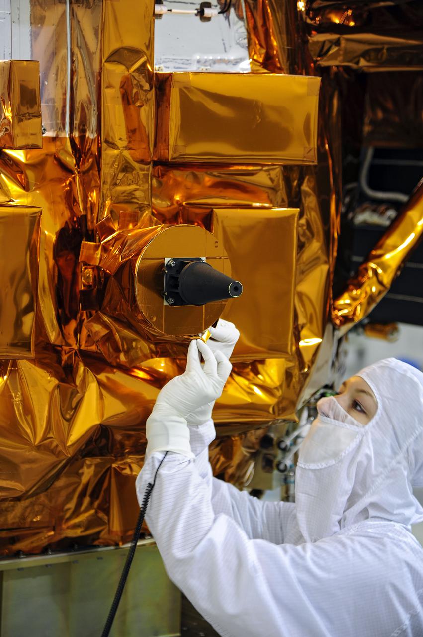 VANDENBERG AFB, Calif. -- At the Astrotech processing facility at Vandenberg Air Force Base, Calif., technicians perform close-out inspections on NASA's Landsat Data Continuity Mission, or LDCM, satellite.   The Landsat Data Continuity Mission LDCM is the future of Landsat satellites. It will continue to obtain valuable data and imagery to be used in agriculture, education, business, science, and government. The Landsat Program provides repetitive acquisition of high resolution multispectral data of the Earth's surface on a global basis. The data from the Landsat spacecraft constitute the longest record of the Earth's continental surfaces as seen from space. It is a record unmatched in quality, detail, coverage, and value. Liftoff is planned for Feb. 11, 2013 aboard a United Launch Alliance Atlas V rocket. For more information, visit: http:__www.nasa.gov_mission_pages_landsat_main_index.html Photo credit: NASA