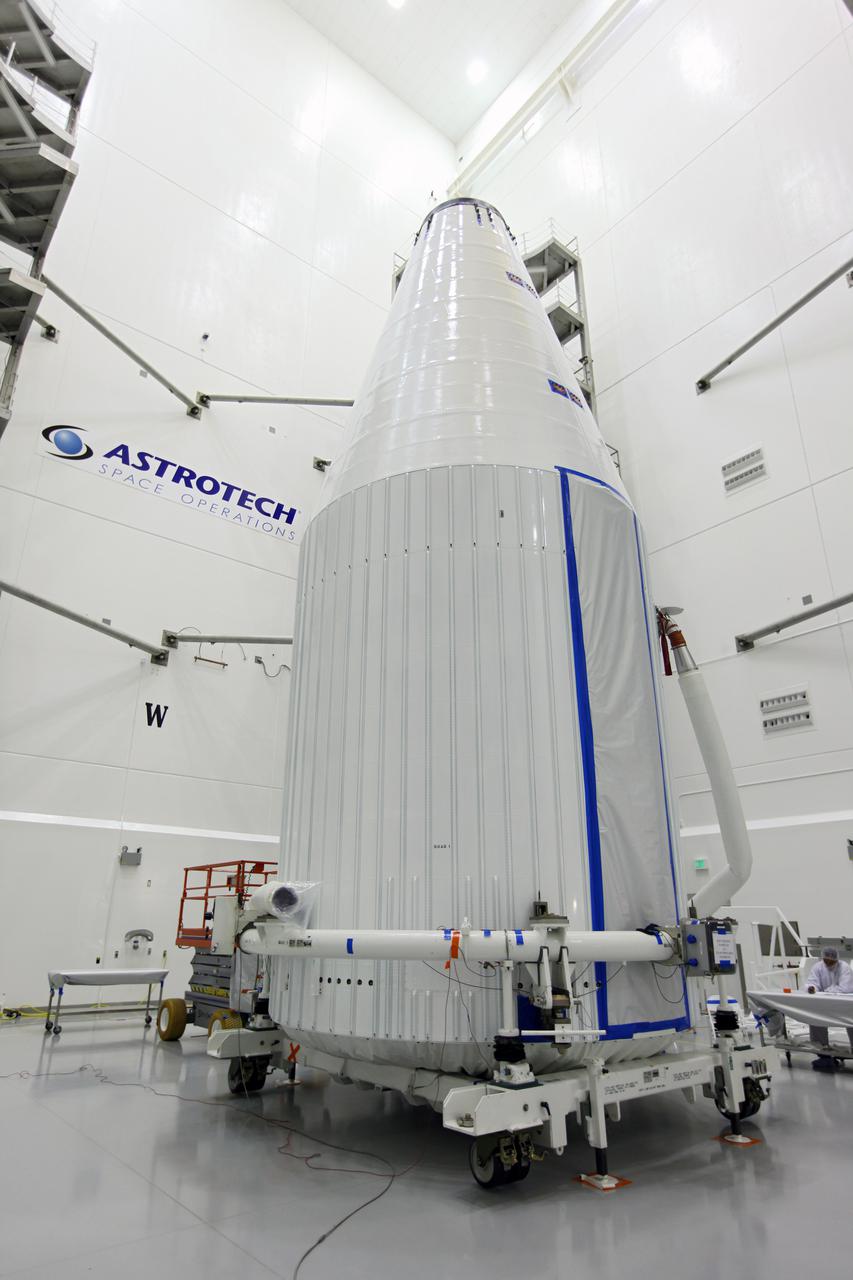 TITUSVILLE, Fla. - Inside the Astrotech payload processing facility in Titusville, Fla. near NASA’s Kennedy Space Center, the Tracking and Data Relay Satellite, TDRS-K, has been encapsulated in its payload fairing. The spacecraft will now be transported to Space Launch Complex 41 at Cape Canaveral Air Force Station. Liftoff for the TDRS-K is planned for January 30, 2013. The TDRS-K spacecraft is part of the next-generation series in the Tracking and Data Relay Satellite System, a constellation of space-based communication satellites providing tracking, telemetry, command and high-bandwidth data return services. For more information, visit http:__www.nasa.gov_mission_pages_tdrs_index.html Photo credit: NASA_Kim Shiflett