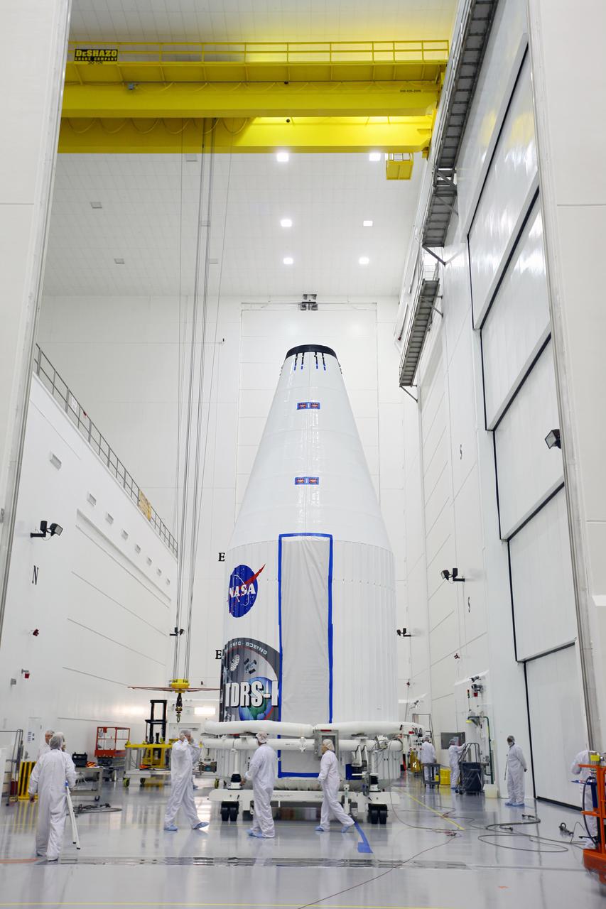 TITUSVILLE, Fla. - Inside the Astrotech payload processing facility in Titusville, Fla. near NASA’s Kennedy Space Center, the Tracking and Data Relay Satellite, TDRS-K, has been encapsulated in its payload fairing. Technicians are completing final checkouts prior to the spacecraft being transported to Space Launch Complex 41 at Cape Canaveral Air Force Station. Liftoff for the TDRS-K is planned for January 30, 2013. The TDRS-K spacecraft is part of the next-generation series in the Tracking and Data Relay Satellite System, a constellation of space-based communication satellites providing tracking, telemetry, command and high-bandwidth data return services. For more information, visit http:__www.nasa.gov_mission_pages_tdrs_index.html Photo credit: NASA_Kim Shiflett