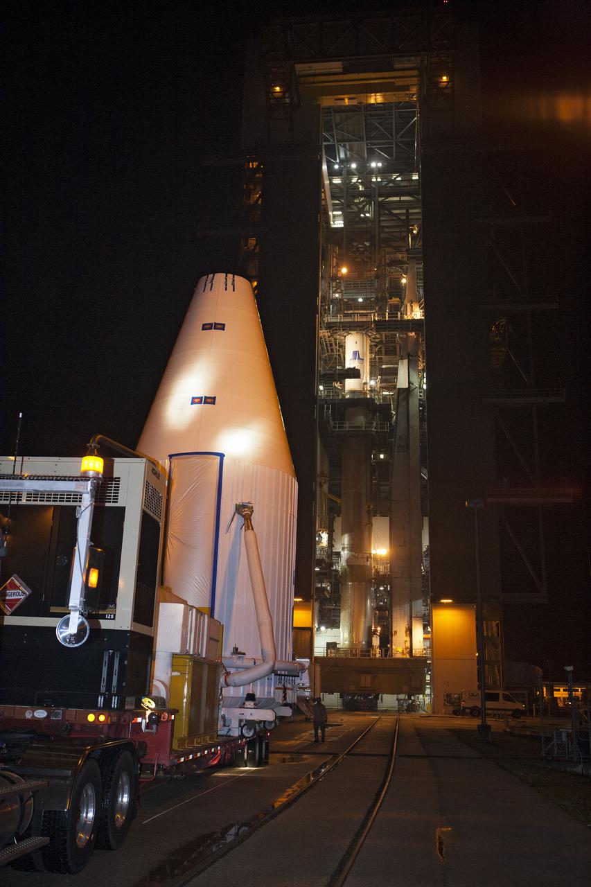 CAPE CANAVERAL, Fla. –- Enclosed in its payload fairing, NASA's Tracking and Data Relay Satellite, TDRS-K, , arrives at Cape Canaveral Air Force Station's Space Launch Complex 41. The spacecraft will now be lifted into position atop a United Launch Alliance Atlas V rocket. Liftoff for the TDRS-K is planned for January 30, 2013. The TDRS-K spacecraft is part of the next-generation series in the Tracking and Data Relay Satellite System, a constellation of space-based communication satellites providing tracking, telemetry, command and high-bandwidth data return services. For more information, visit http:__www.nasa.gov_mission_pages_tdrs_index.html Photo credit: NASA_ Glenn Bension