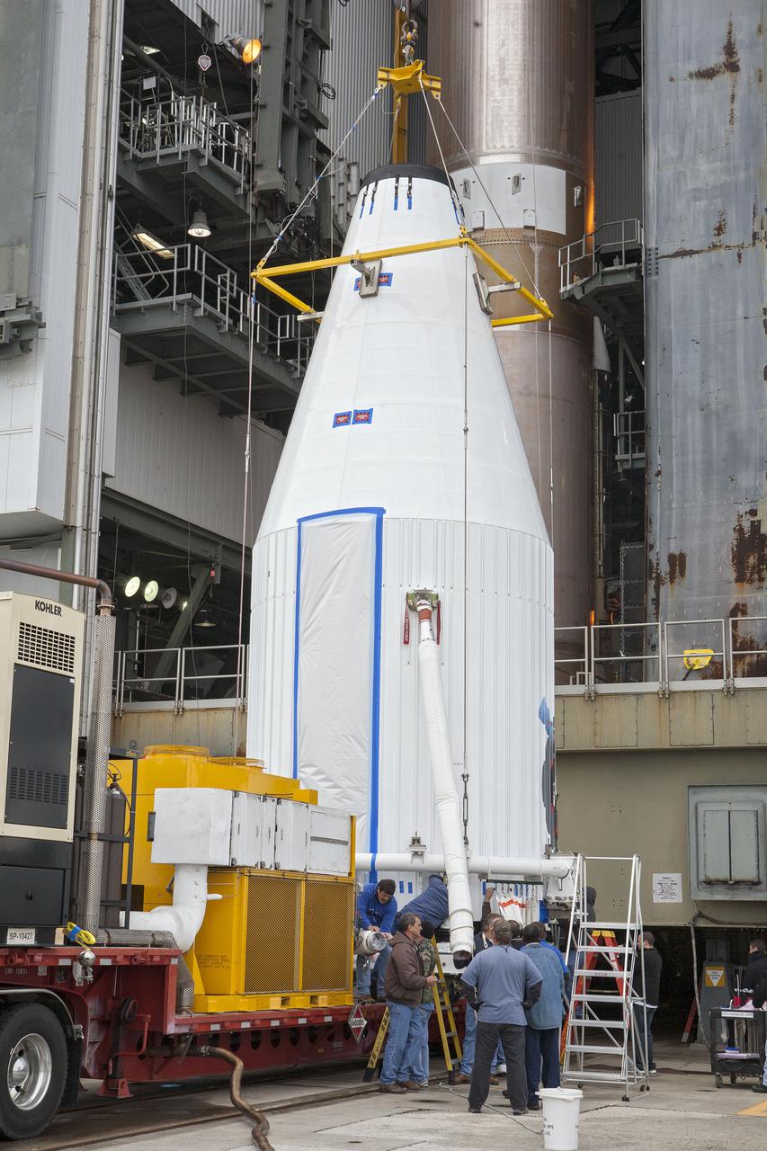 CAPE CANAVERAL, Fla. –- Enclosed in its payload fairing, NASA's Tracking and Data Relay Satellite, TDRS-K, is being prepare for the lift that will place it atop a United Launch Alliance Atlas V rocket at Cape Canaveral Air Force Station's Space Launch Complex 41. Liftoff for the TDRS-K is planned for January 30, 2013. The TDRS-K spacecraft is part of the next-generation series in the Tracking and Data Relay Satellite System, a constellation of space-based communication satellites providing tracking, telemetry, command and high-bandwidth data return services. For more information, visit http:__www.nasa.gov_mission_pages_tdrs_index.html Photo credit: NASA_ Glenn Bension