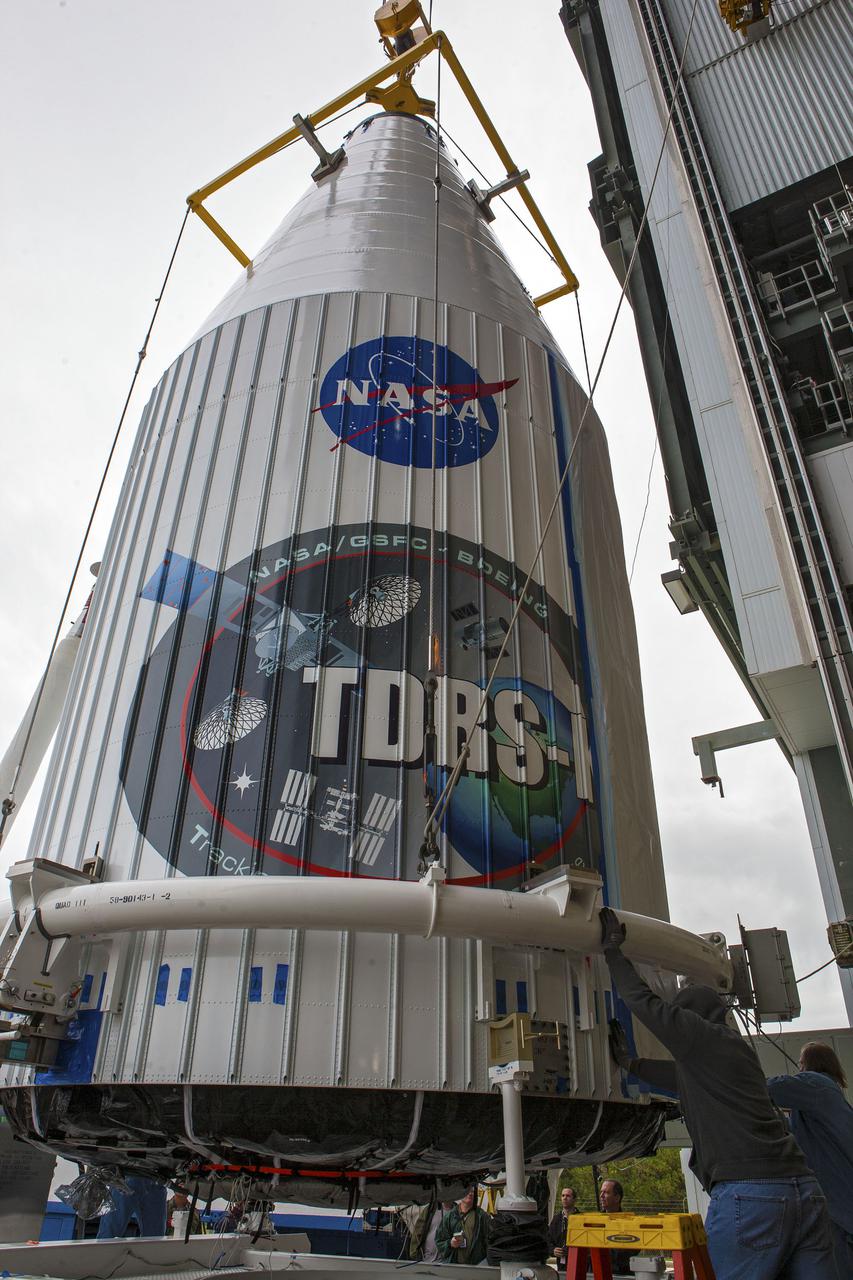 CAPE CANAVERAL, Fla. –- Enclosed in its payload fairing, NASA's Tracking and Data Relay Satellite, TDRS-K, is being prepare for the lift that will place it atop a United Launch Alliance Atlas V rocket at Cape Canaveral Air Force Station's Space Launch Complex 41. Liftoff for the TDRS-K is planned for January 30, 2013. The TDRS-K spacecraft is part of the next-generation series in the Tracking and Data Relay Satellite System, a constellation of space-based communication satellites providing tracking, telemetry, command and high-bandwidth data return services. For more information, visit http:__www.nasa.gov_mission_pages_tdrs_index.html Photo credit: NASA_ Glenn Bension