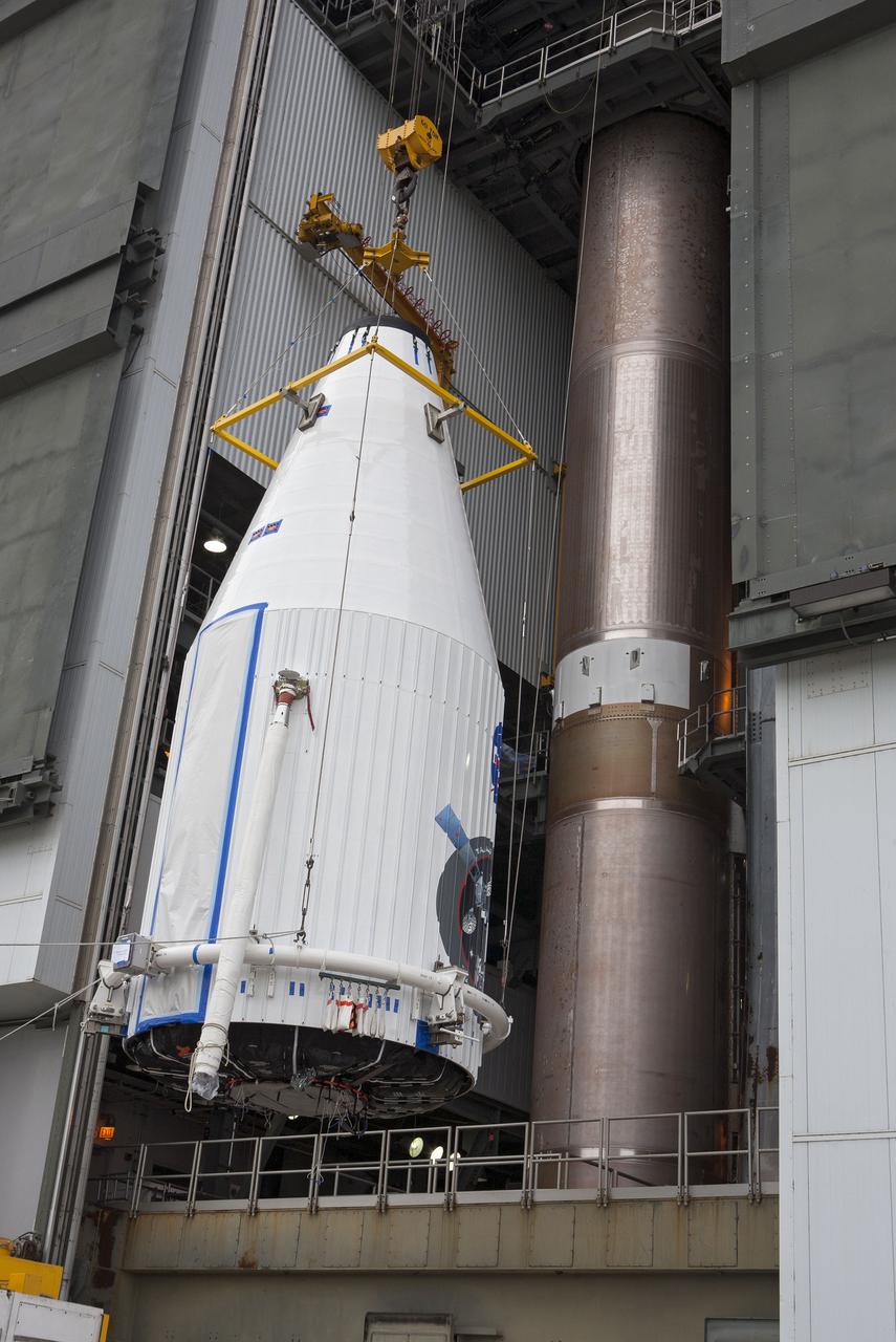 CAPE CANAVERAL, Fla. –- Enclosed in its payload fairing, NASA's Tracking and Data Relay Satellite, TDRS-K, is being lifted for placement atop a United Launch Alliance Atlas V rocket at Cape Canaveral Air Force Station's Space Launch Complex 41. Liftoff for the TDRS-K is planned for January 30, 2013. The TDRS-K spacecraft is part of the next-generation series in the Tracking and Data Relay Satellite System, a constellation of space-based communication satellites providing tracking, telemetry, command and high-bandwidth data return services. For more information, visit http:__www.nasa.gov_mission_pages_tdrs_index.html Photo credit: NASA_ Glenn Bension