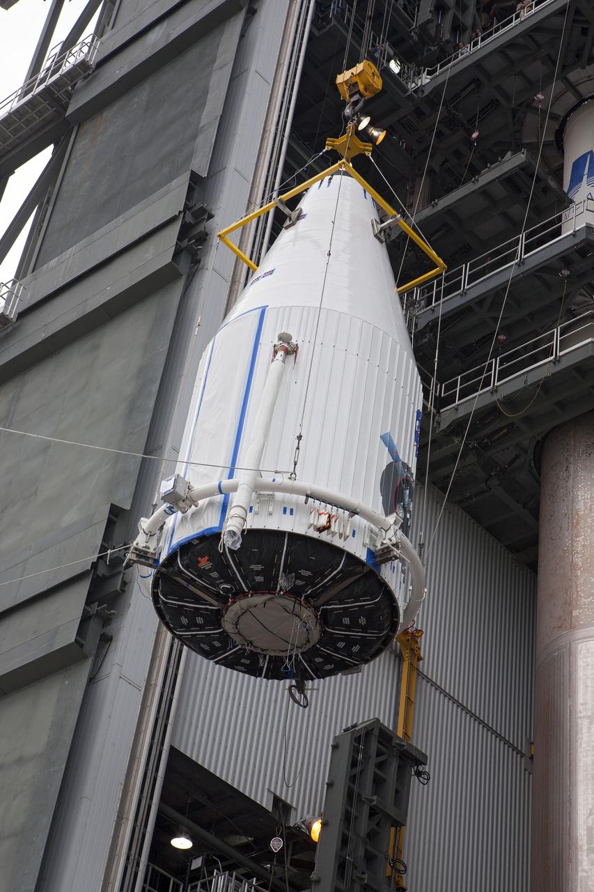 CAPE CANAVERAL, Fla. –- Enclosed in its payload fairing, NASA's Tracking and Data Relay Satellite, TDRS-K, is being lifted for placement atop a United Launch Alliance Atlas V rocket at Cape Canaveral Air Force Station's Space Launch Complex 41. Liftoff for the TDRS-K is planned for January 30, 2013. The TDRS-K spacecraft is part of the next-generation series in the Tracking and Data Relay Satellite System, a constellation of space-based communication satellites providing tracking, telemetry, command and high-bandwidth data return services. For more information, visit http:__www.nasa.gov_mission_pages_tdrs_index.html Photo credit: NASA_ Glenn Bension