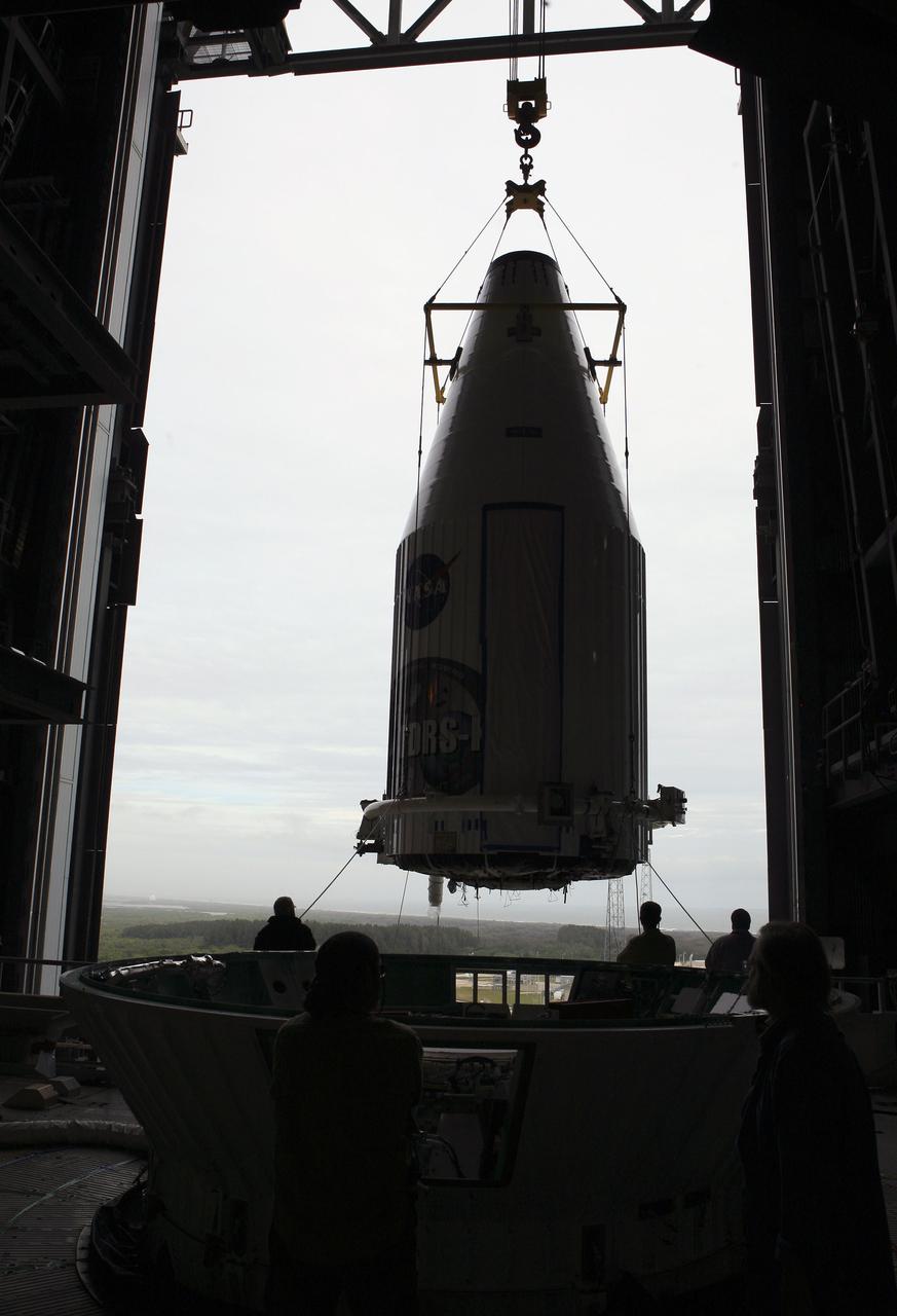 CAPE CANAVERAL, Fla. –- Enclosed in its payload fairing, NASA's Tracking and Data Relay Satellite, TDRS-K, is being moved into position for placement atop a United Launch Alliance Atlas V rocket at Cape Canaveral Air Force Station's Space Launch Complex 41. Liftoff for the TDRS-K is planned for January 30, 2013. The TDRS-K spacecraft is part of the next-generation series in the Tracking and Data Relay Satellite System, a constellation of space-based communication satellites providing tracking, telemetry, command and high-bandwidth data return services. For more information, visit http:__www.nasa.gov_mission_pages_tdrs_index.html Photo credit: NASA_ Glenn Bension