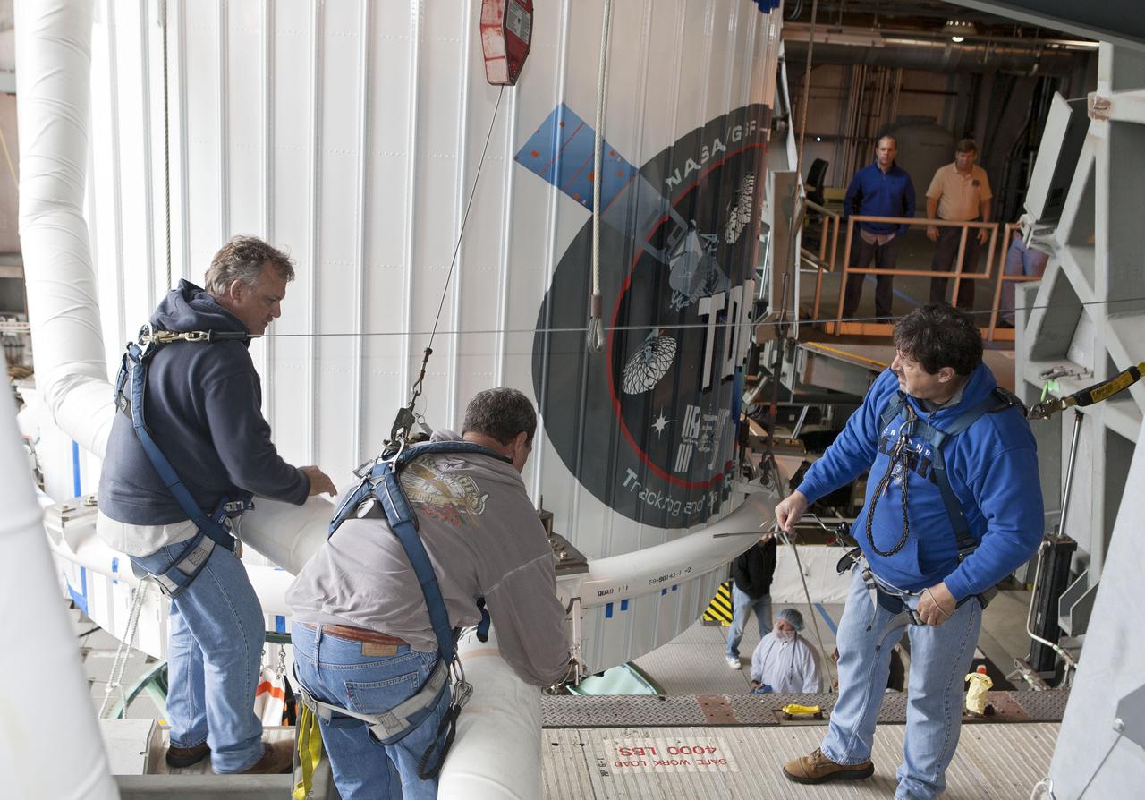 CAPE CANAVERAL, Fla. –- Technicians move NASA's Tracking and Data Relay Satellite, TDRS-K, into position for mating to a United Launch Alliance Atlas V rocket at Cape Canaveral Air Force Station's Space Launch Complex 41. Liftoff for the TDRS-K is planned for January 30, 2013. The TDRS-K spacecraft is part of the next-generation series in the Tracking and Data Relay Satellite System, a constellation of space-based communication satellites providing tracking, telemetry, command and high-bandwidth data return services. For more information, visit http:__www.nasa.gov_mission_pages_tdrs_index.html Photo credit: NASA_ Glenn Bension