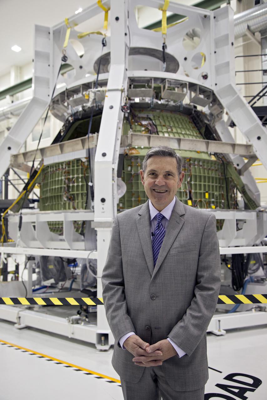 CAPE CANAVERAL, Fla. – Inside the high bay of Kennedy Space Center's Operations and Checkout Building, Kennedy Director Bob Cabana, stands in front of the Orion spacecraft which is surrounded by a special pre-launch processing access fixture.   Orion is the exploration spacecraft designed to carry crews to space beyond low Earth orbit. It will provide emergency abort capability, sustain the crew during the space travel and provide safe re-entry from deep space return velocities. The first unpiloted test flight of the Orion is scheduled to launch in 2014 atop a Delta IV rocket and in 2017 on a Space Launch System rocket. For more information, visit http:__www.nasa.gov_orion Photo credit: NASA_Kim Shiflett