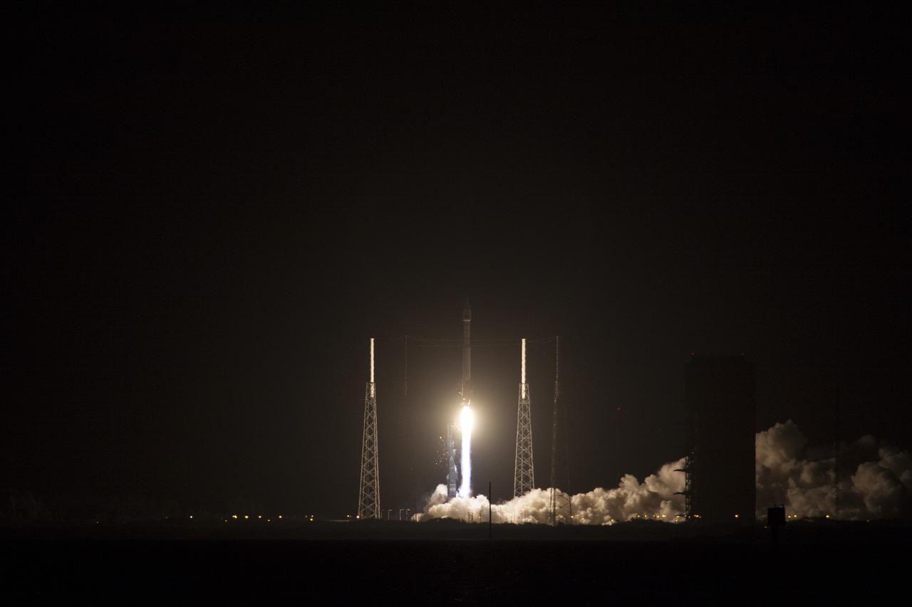 CAPE CANAVERAL, Fla. -- Plumes of exhaust and smoke build around the base of a lightning mast on Space Launch Complex 41 on Cape Canaveral Air Force Station in Florida as a United Launch Alliance Atlas V 401 rocket lifts off at 8:48 p.m. EST, carrying NASA's Tracking and Data Relay Satellite-K, TDRS-K,  to orbit.  The TDRS-K spacecraft is part of the next-generation series in the Tracking and Data Relay Satellite System, a constellation of space-based communication satellites providing tracking, telemetry, command and high-bandwidth data return services. For more information, visit http:__www.nasa.gov_mission_pages_tdrs_index.html.  Photo credit: NASA_Jim Grossmann