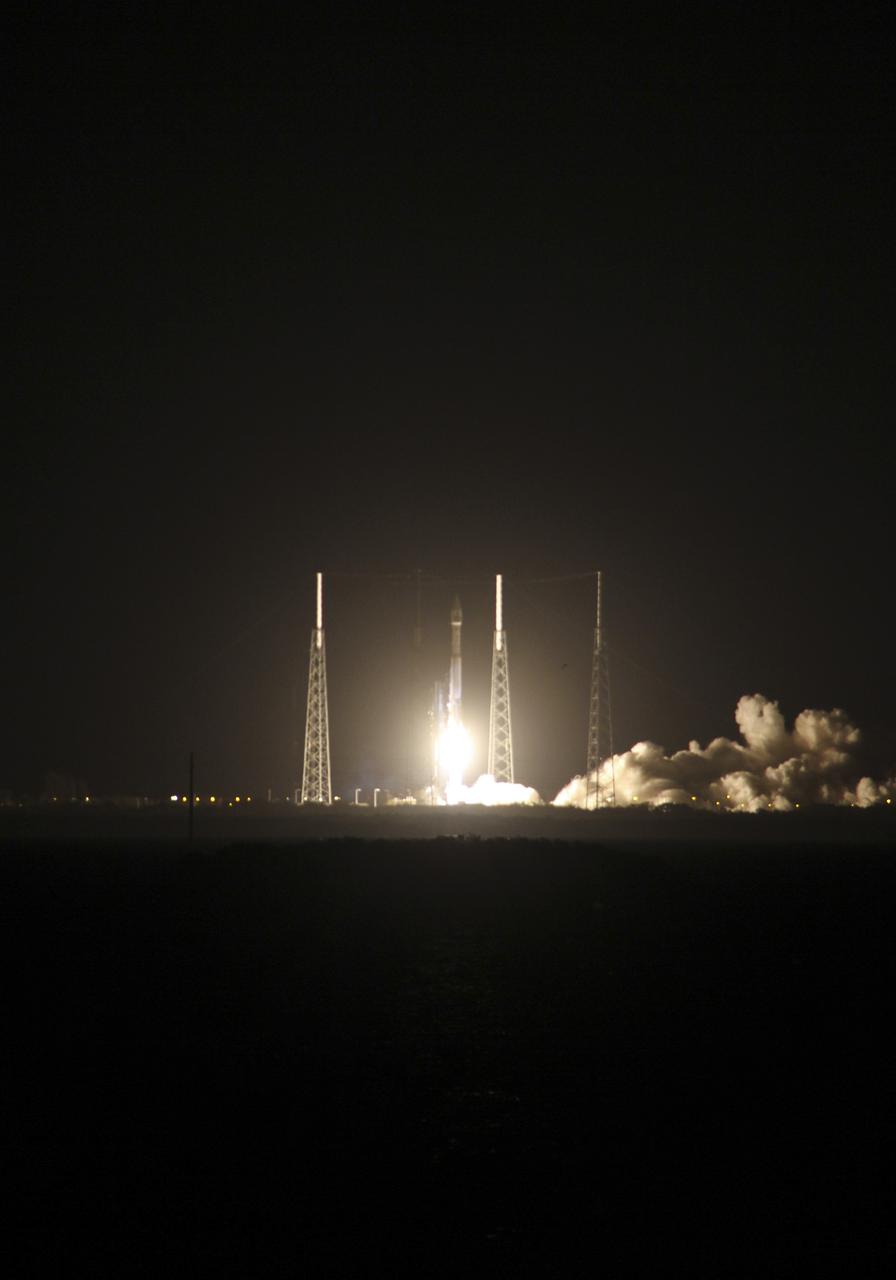 CAPE CANAVERAL, Fla. -- Space Launch Complex 41 on Cape Canaveral Air Force Station in Florida is illuminated by a United Launch Alliance Atlas V 401 rocket as it lifts off at 8:48 p.m. EST, carrying NASA's Tracking and Data Relay Satellite-K, TDRS-K, to orbit.  The TDRS-K spacecraft is part of the next-generation series in the Tracking and Data Relay Satellite System, a constellation of space-based communication satellites providing tracking, telemetry, command and high-bandwidth data return services. For more information, visit http:__www.nasa.gov_mission_pages_tdrs_index.html.  Photo credit: NASA_Scott Neener and Cory Huston