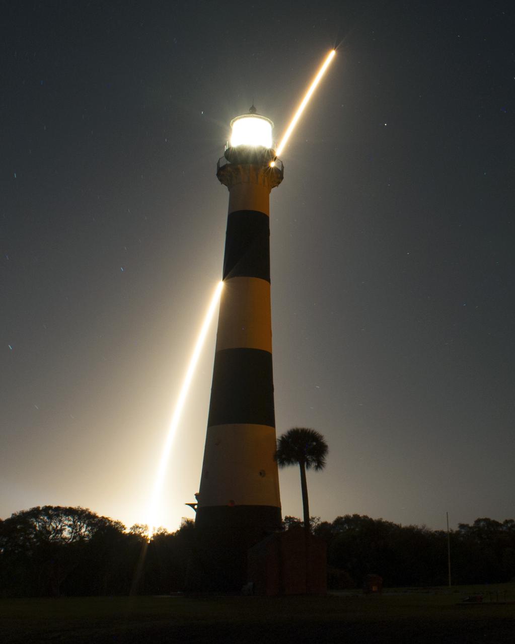 CAPE CANAVERAL, Fla. -- The United Launch Alliance Atlas V 401 rocket carrying NASA's Tracking and Data Relay Satellite-K, TDRS-K, streaks past the lighthouse on Cape Canaveral Air Force Station in Florida after launching from Space Launch Complex 41 at 8:48 p.m. EST.   The TDRS-K spacecraft is part of the next-generation series in the Tracking and Data Relay Satellite System, a constellation of space-based communication satellites providing tracking, telemetry, command and high-bandwidth data return services. For more information, visit http:__www.nasa.gov_mission_pages_tdrs_index.html.  Photo credit: NASA_Rick Wetherington