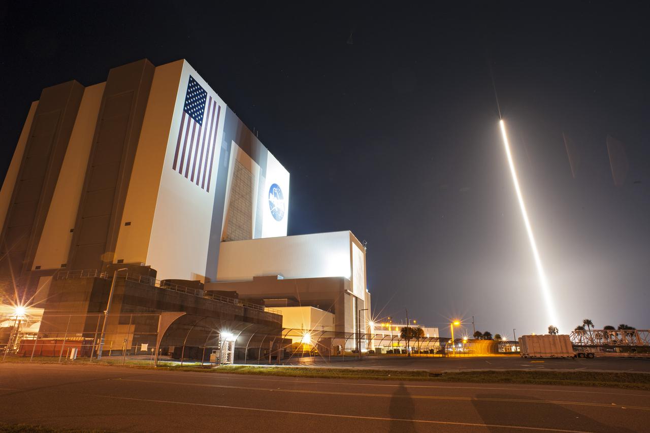 CAPE CANAVERAL, Fla. -- The United Launch Alliance Atlas V 401 rocket carrying NASA's Tracking and Data Relay Satellite-K, TDRS-K, streaks past the Vehicle Assembly Building and Launch Complex 39 at Kennedy Space Center in Florida after launching from Space Launch Complex 41 at 8:48 p.m. EST.    The TDRS-K spacecraft is part of the next-generation series in the Tracking and Data Relay Satellite System, a constellation of space-based communication satellites providing tracking, telemetry, command and high-bandwidth data return services. For more information, visit http:__www.nasa.gov_mission_pages_tdrs_index.html.  Photo credit: NASA_Tony Gray