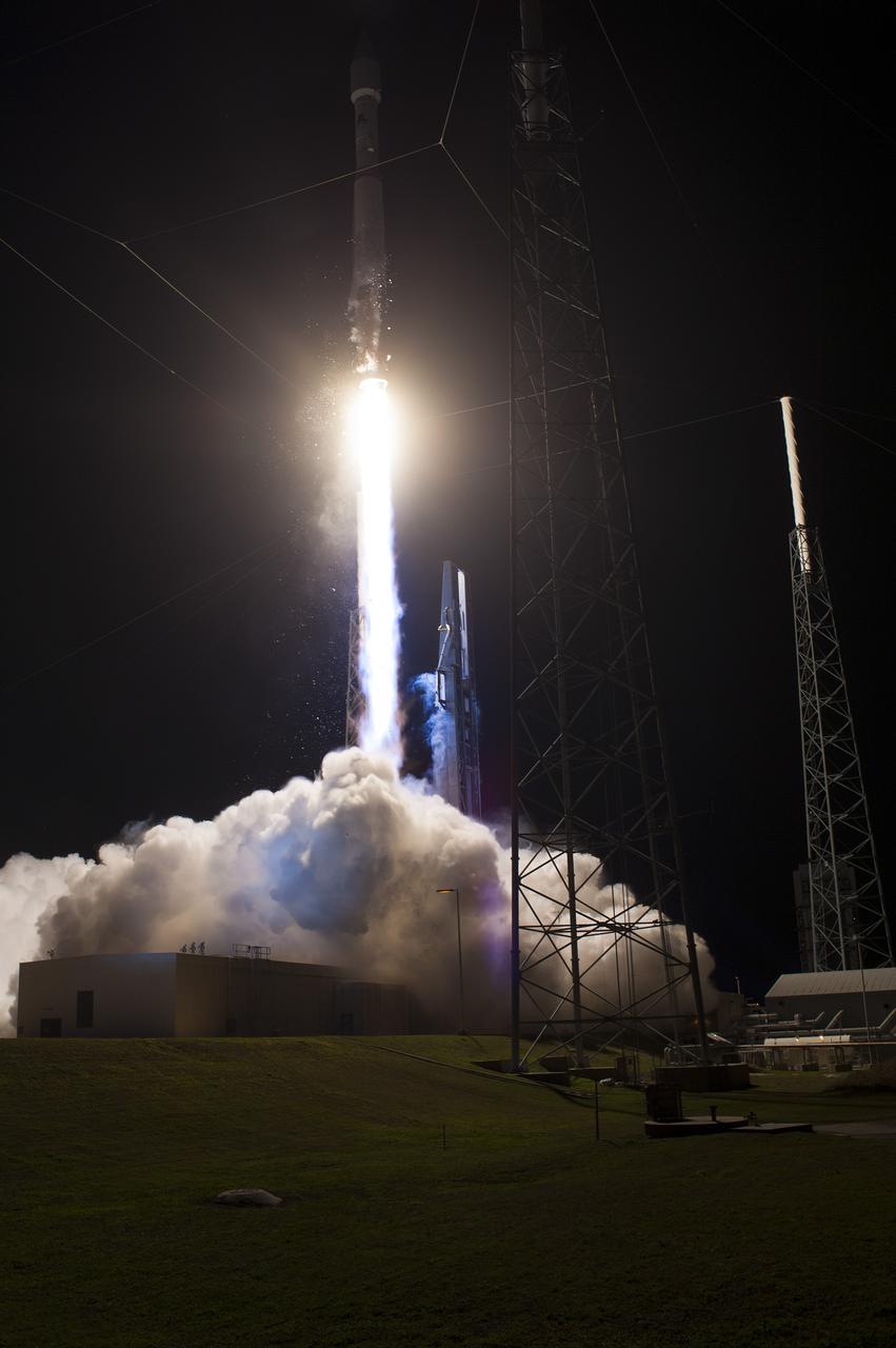CAPE CANAVERAL, Fla. -- A United Launch Alliance Atlas V 401 rocket races above the lightning masts on Space Launch Complex 41 on Cape Canaveral Air Force Station in Florida, leaving plumes of exhaust and smoke in its wake. Its payload, NASA's Tracking and Data Relay Satellite-K or TDRS-K, began its climb to orbit at 8:48 p.m. EST. The TDRS-K spacecraft is part of the next-generation series in the Tracking and Data Relay Satellite System, a constellation of space-based communication satellites providing tracking, telemetry, command and high-bandwidth data return services. For more information, visit http:__www.nasa.gov_mission_pages_tdrs_index.html. Photo credit: NASA_Tony Gray and Robert Murray