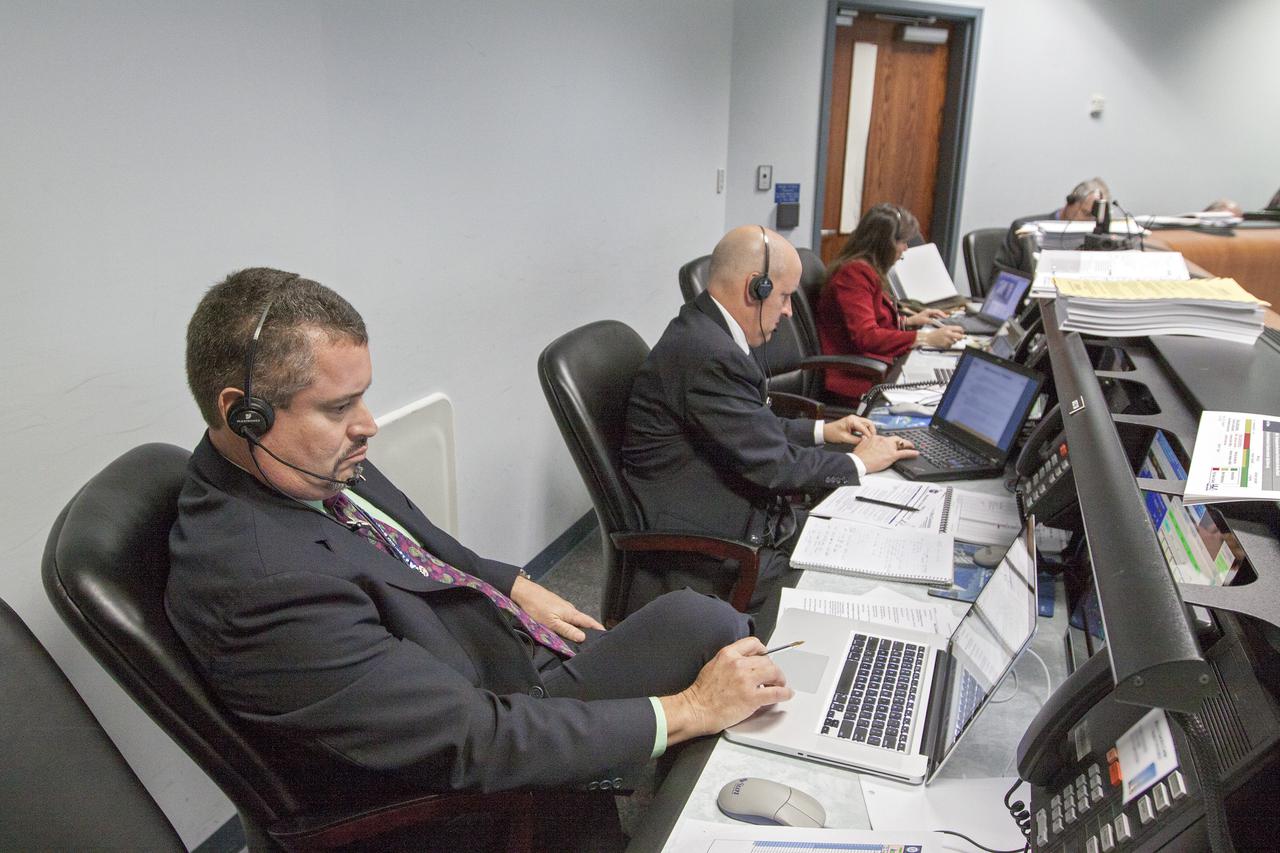 CAPE CANAVERAL, Fla. – Tim Dunn, NASA launch manager, center, monitors the countdown for the launch of the TDRS-K spacecraft on an Atlas V rocket. Omar Baez, assistant NASA launch manager, left, and Diana Calero, NASA mission manager, right, also participate in the countdown procedures before the liftoff. The launch teams for NASA and the United Launch Alliance work inside the Atlas Space Operations Center at Cape Canaveral Air Force Station, Fla., known as the ASOC. Photo credit: NASA_Kim Shiflett