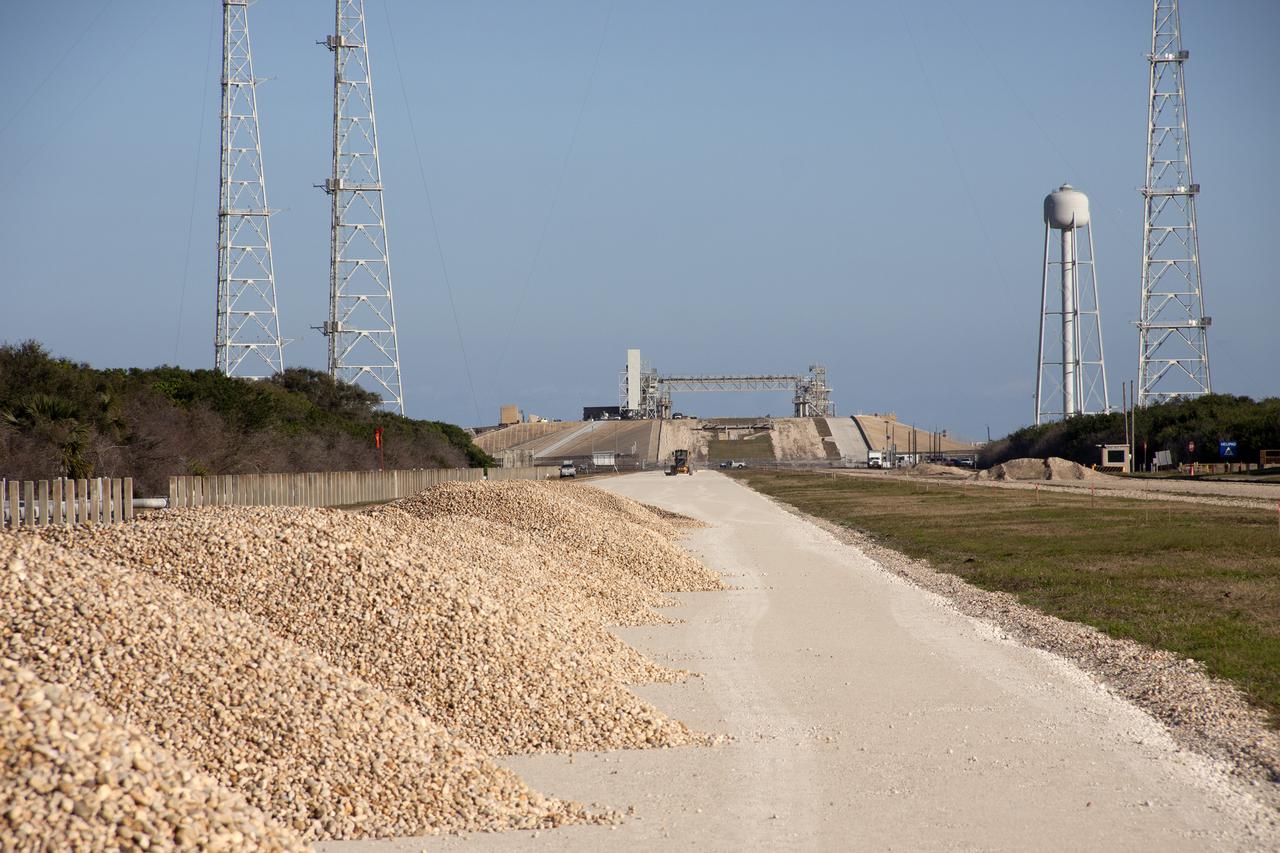 CAPE CANAVERAL, Fla. – Workers from Canaveral Construction in Mims, Fla., have removed the Alabama river rock from one side of the crawlerway near Launch Pad 39B at NASA’s Kennedy Space Center in Florida.  The crawlerway is being upgraded to improve the foundation and prepare it to support the weight of NASA’s Space Launch System, or SLS, and mobile launcher on the crawler-transporter during rollout. Workers are removing the original Alabama river rock and restoring the layer of lime rock below to its original depth of three feet. Then new river rock will be added on top. The Ground Systems Development and Operations, or GSDO, Program office at Kennedy is leading the center’s transformation to safely handle a variety of rockets and spacecraft. For more information about GSDO, visit: http:__go.nasa.gov_groundsystems.  Photo credit: NASA_Jim Grossmann